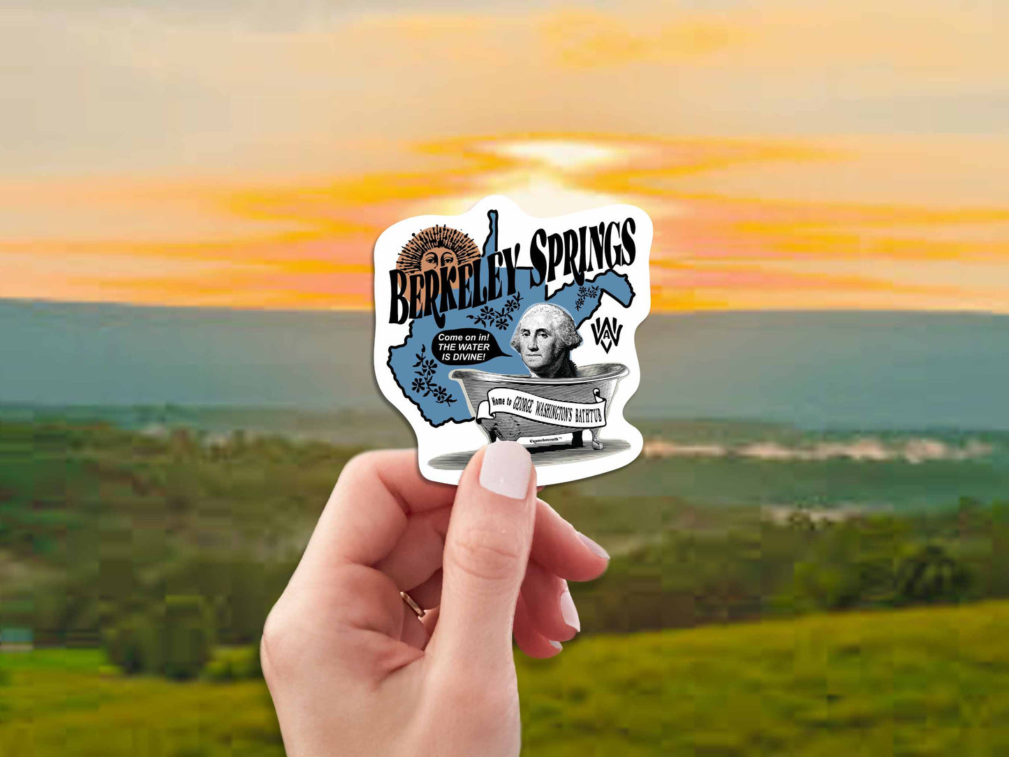 berkeley springs travel luggage sticker, hand display, sky background