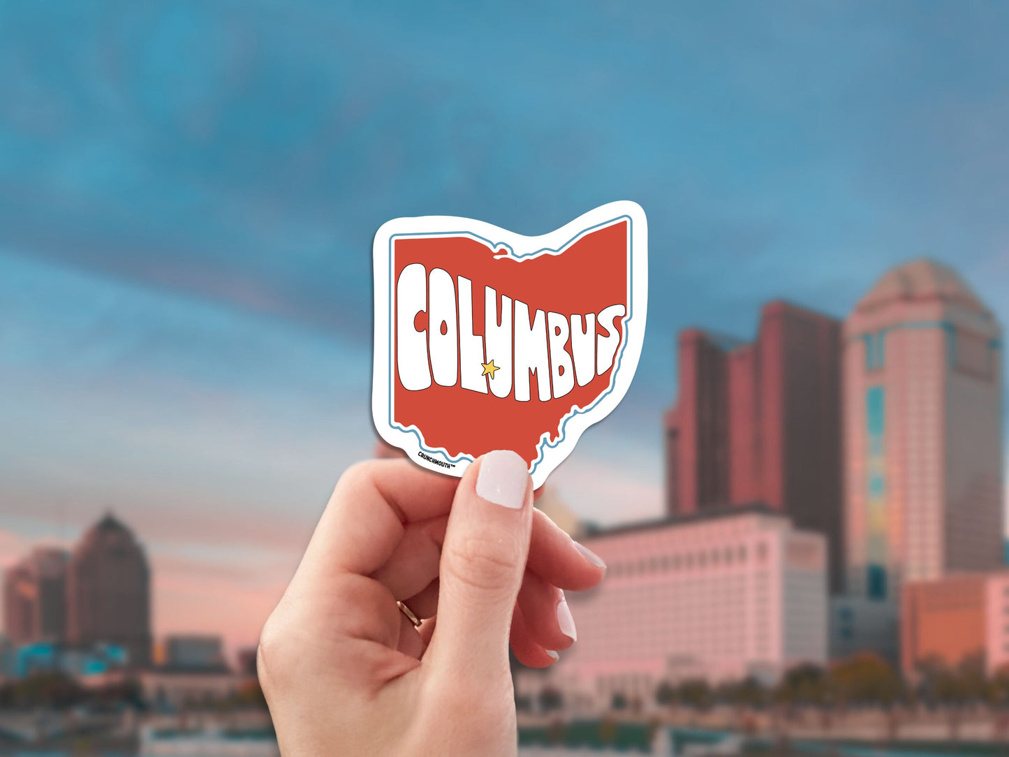 columbus ohio travel luggage sticker, hand display, city skyline background