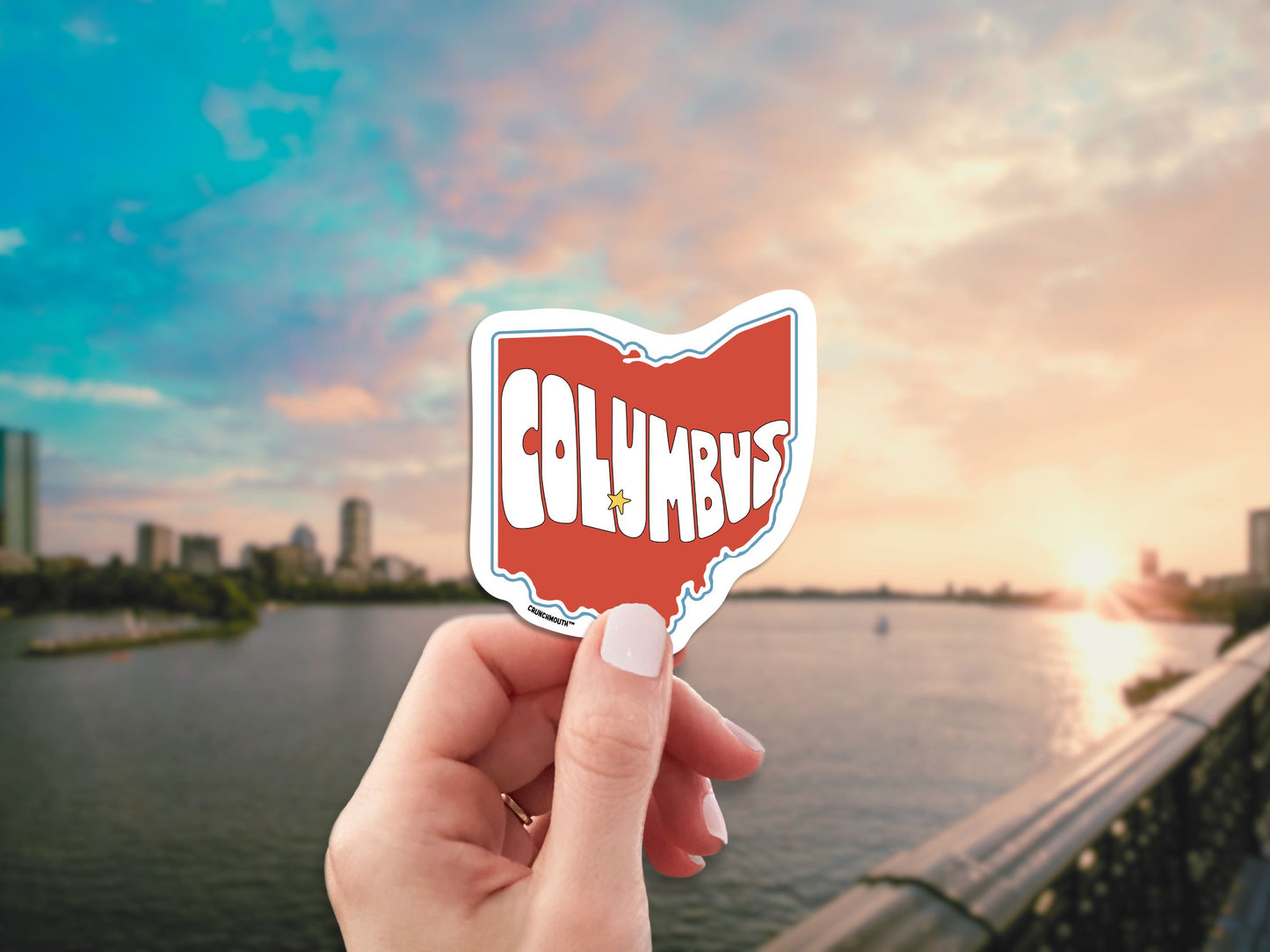 columbus ohio travel luggage sticker, hand display, cityscape background