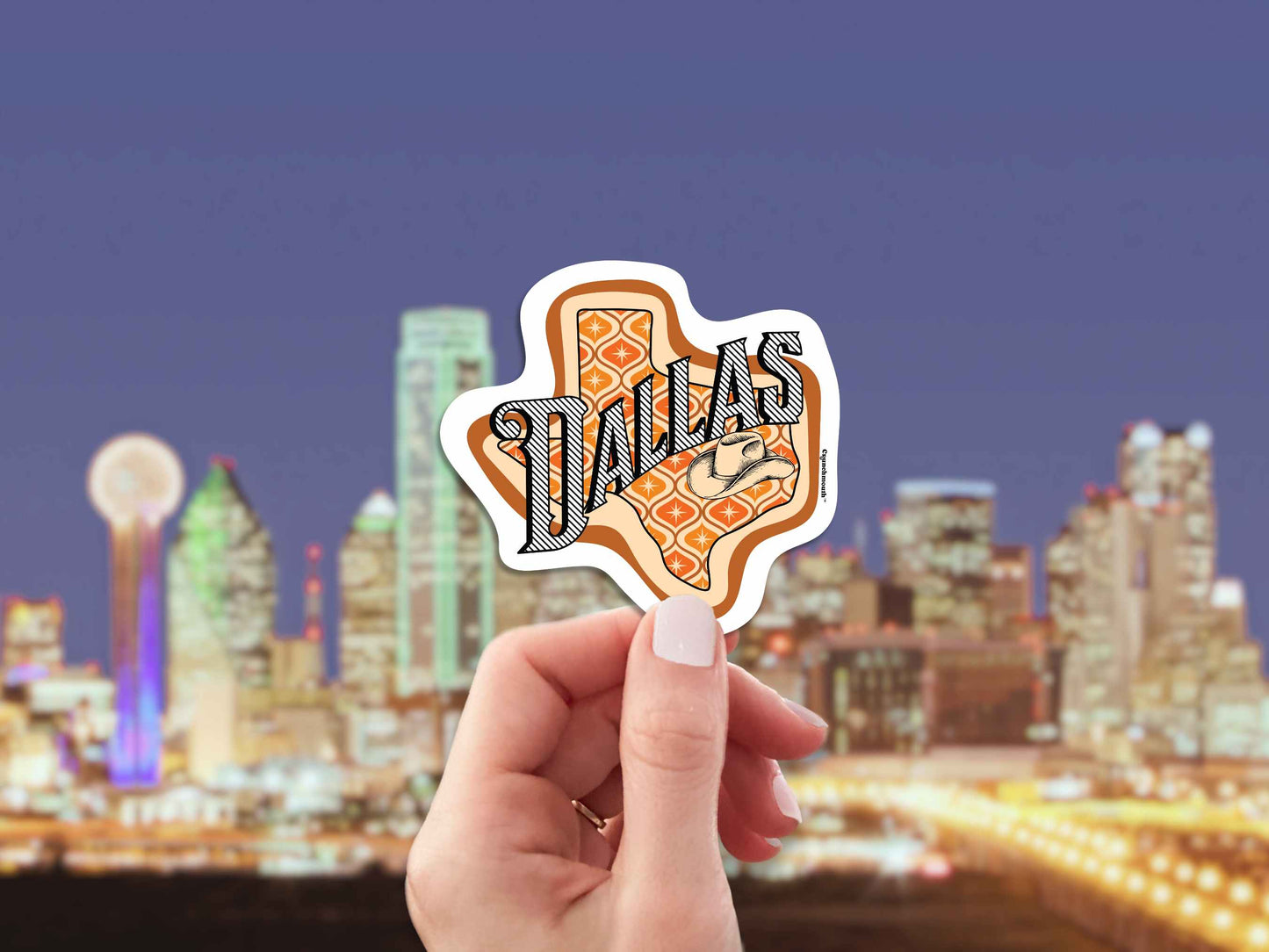 dallas travel luggage sticker, hand display, city skyline background