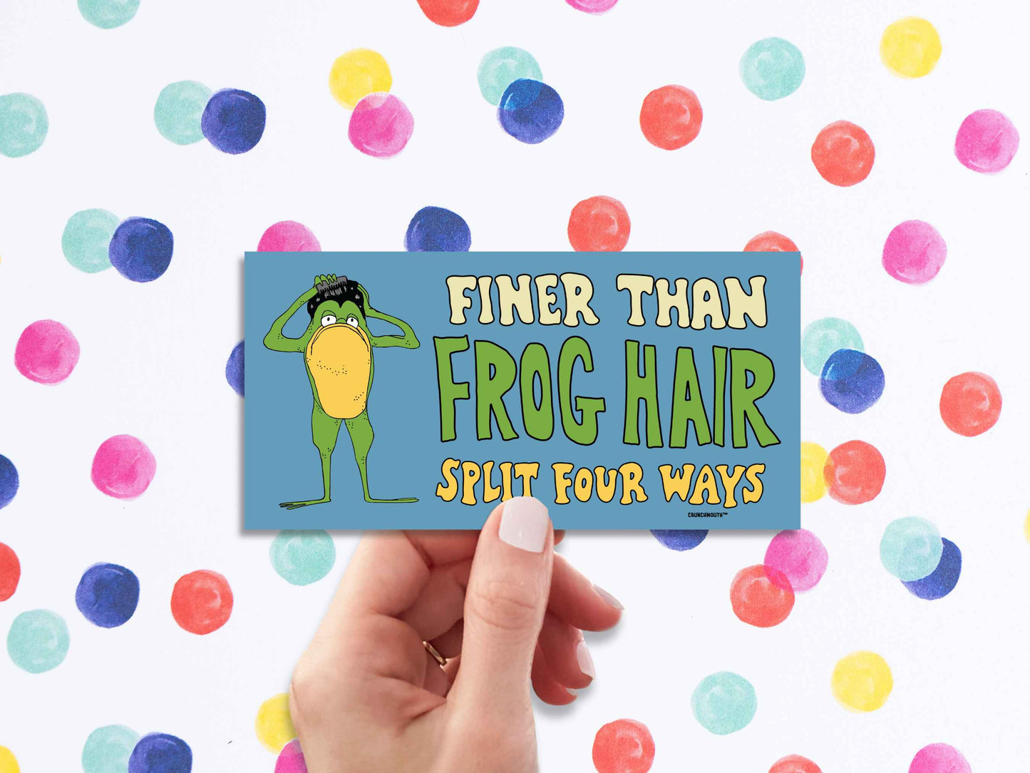 finer than frog hair split four ways bumper sticker, funny greaser frog combing hair, hand display, polka dots background