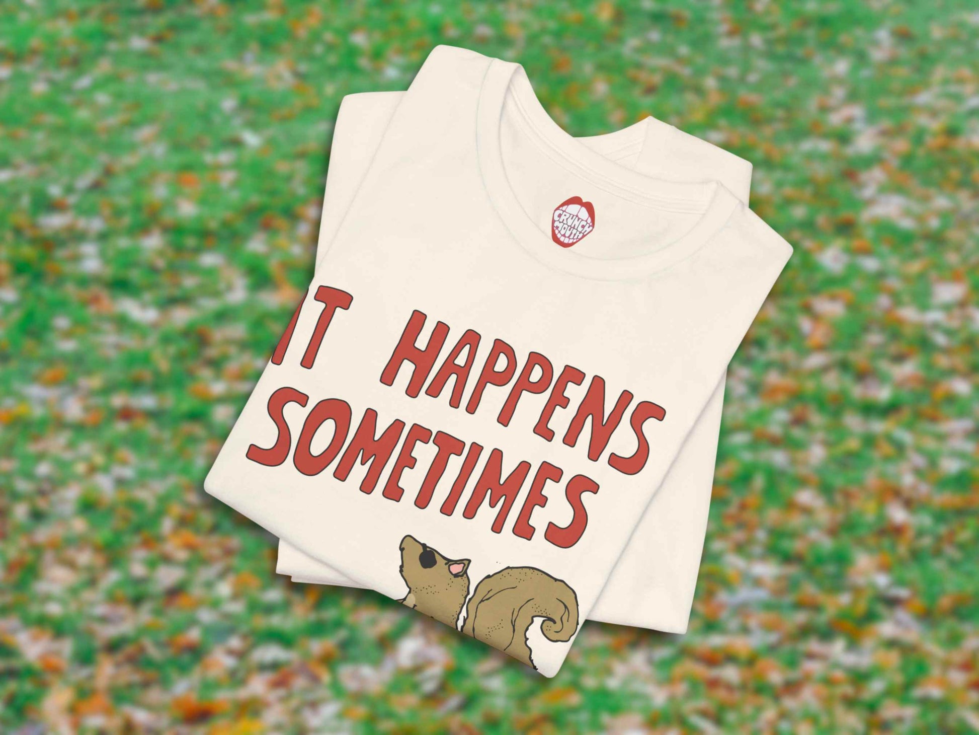 funny squirrel shirt, even a blind squirrel finds a nut sometimes, folded, leaves on grass background