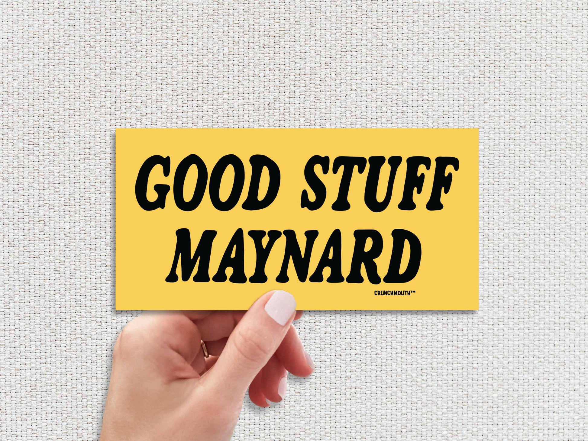 good stuff maynard bumper sticker, hand display, white textured background
