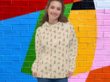 angry goose hooded sweatshirt, front, female, vibrant color brick wall background