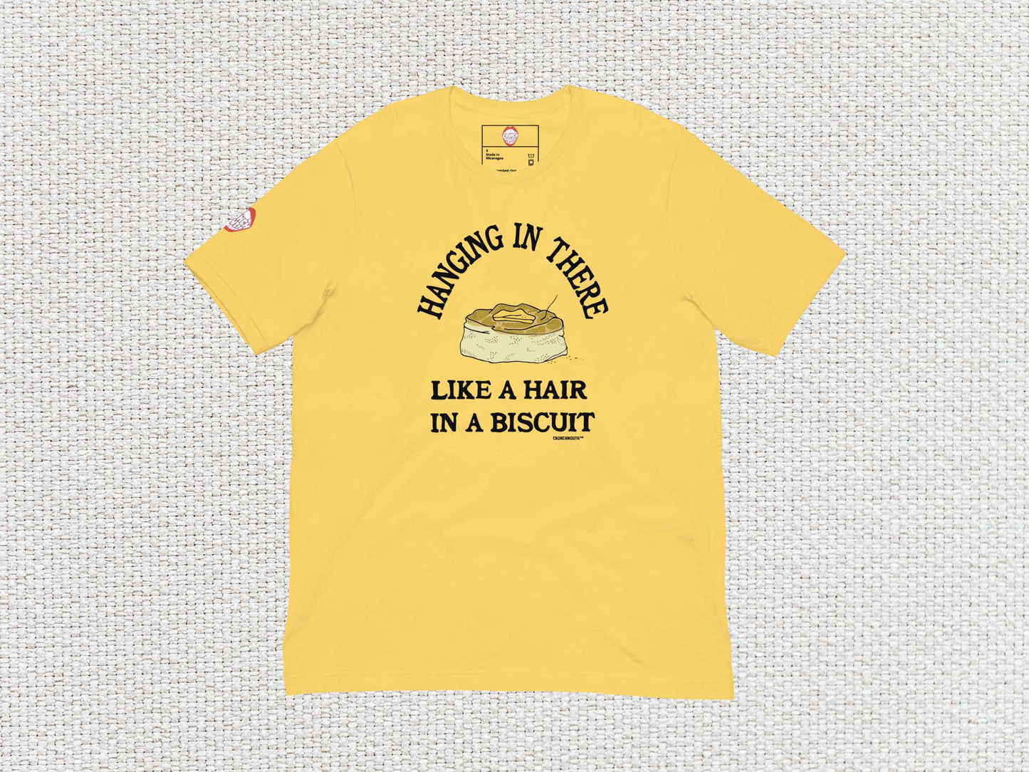 hanging in there like a hair in a biscuit shirt, funny t-shirts, flat, front, white textured background