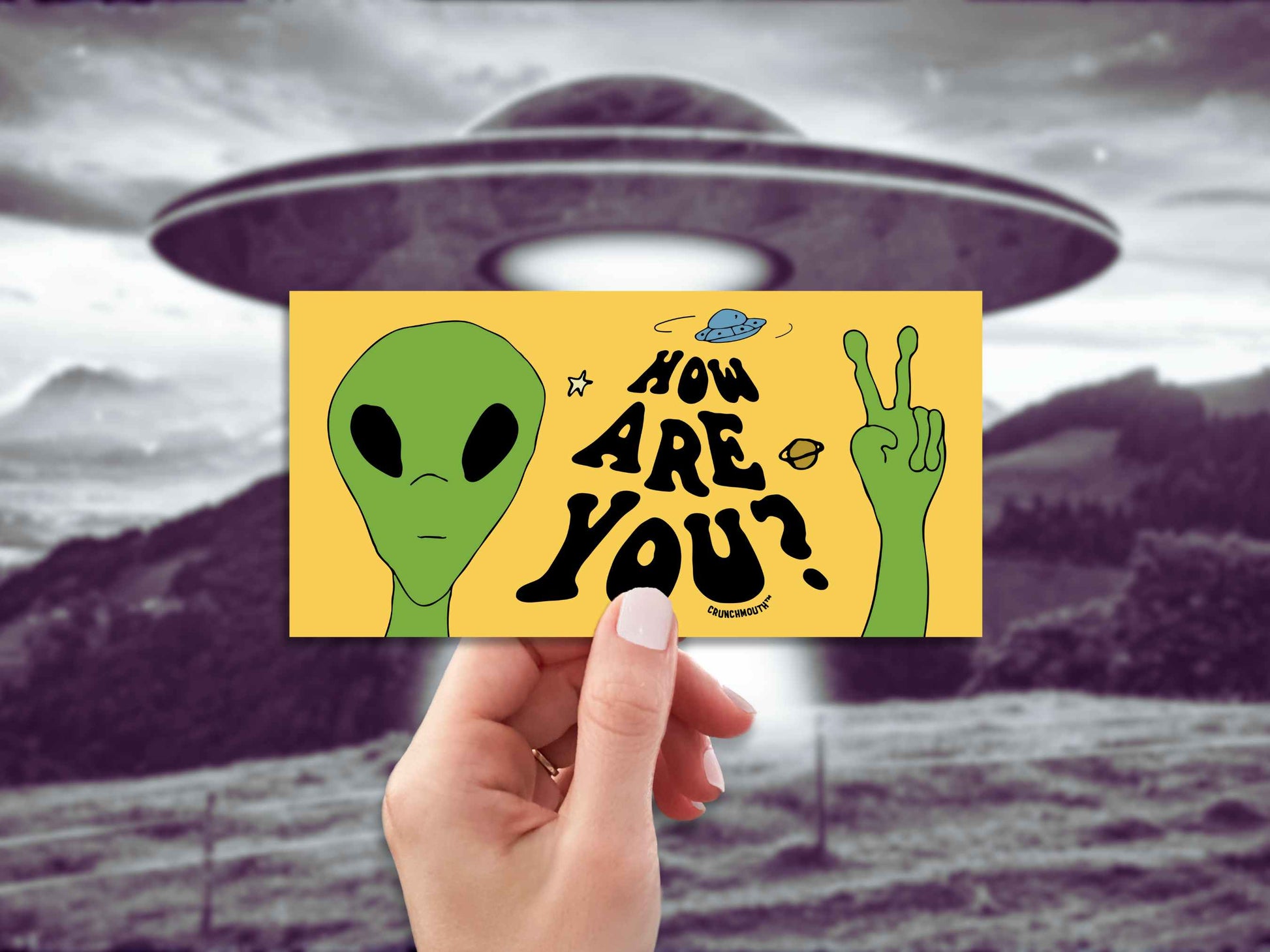 how are you? bumper sticker, green alien, martian from outer space, hand display, ufo background
