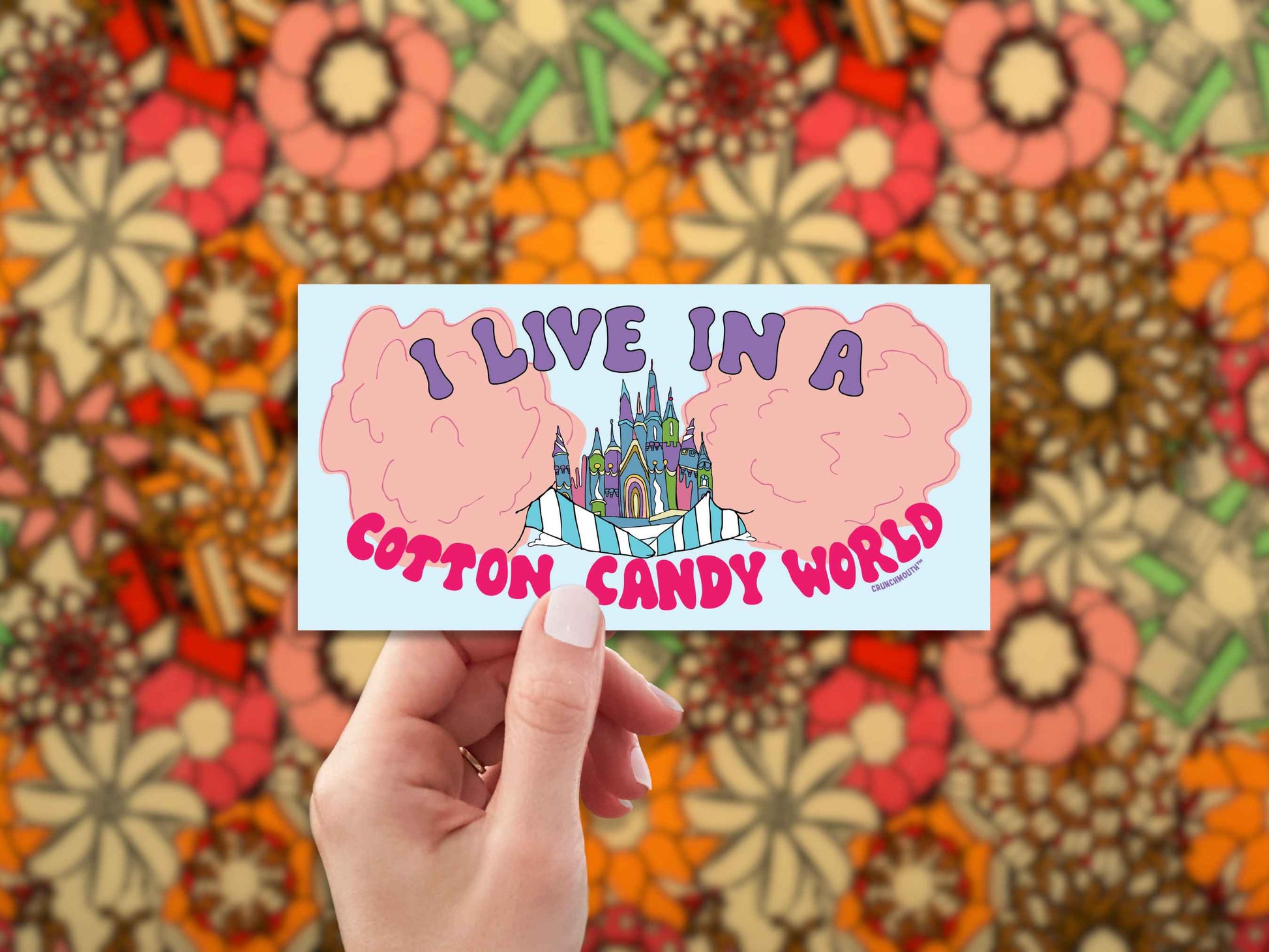i live in a cotton candy world bumper sticker, hand display, 1960s fabric pattern background