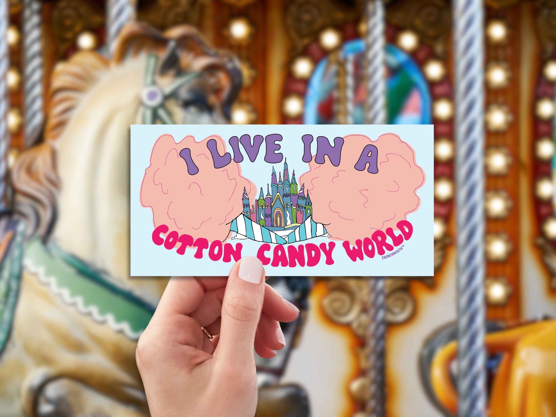 i live in a cotton candy world bumper sticker, hand display, carousel background