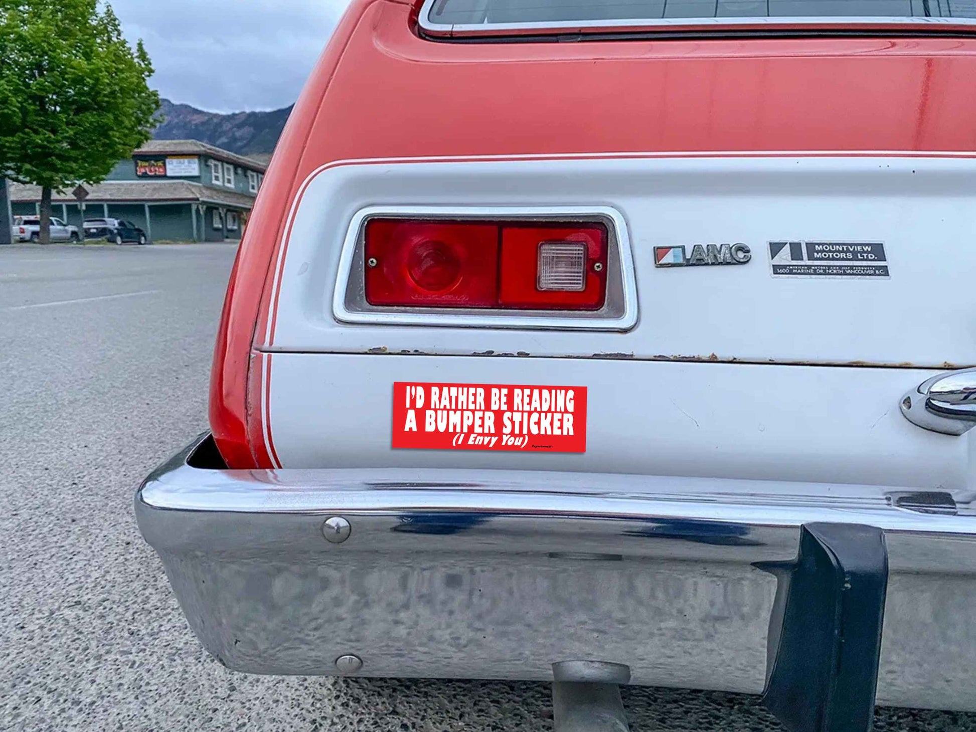 i'd rather be reading a bumper sticker (i envy you), funny bumper stickers, displayed on back of car