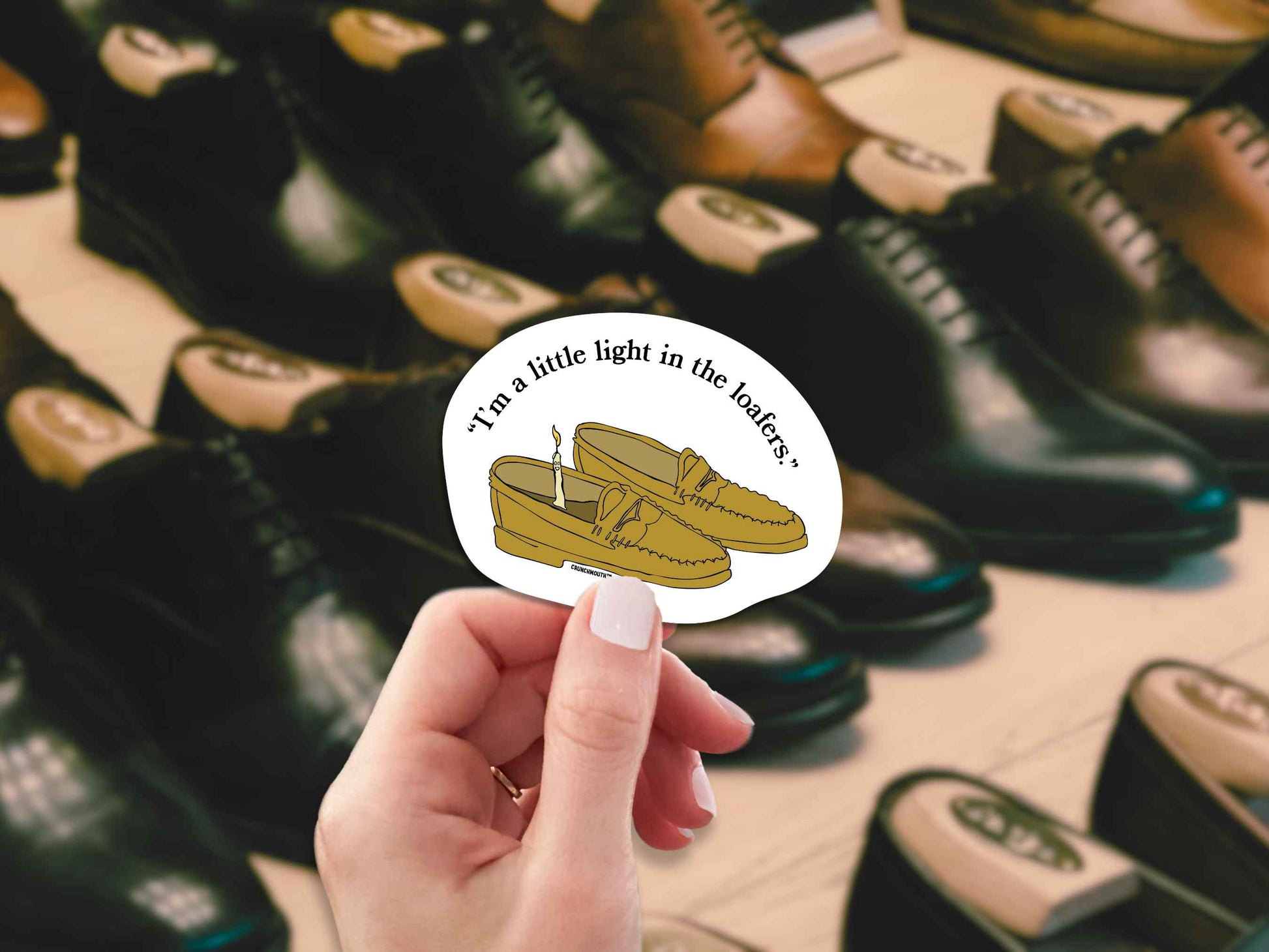 i'm a little light in the loafers funny pun sticker, hand display, men's dress shoes background