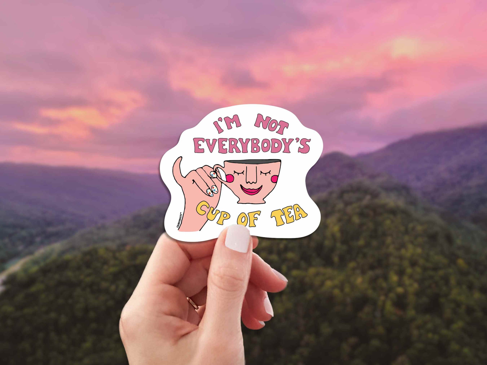 i'm not everybody's cup of tea laptop sticker, hand display, colorful mountain sky background