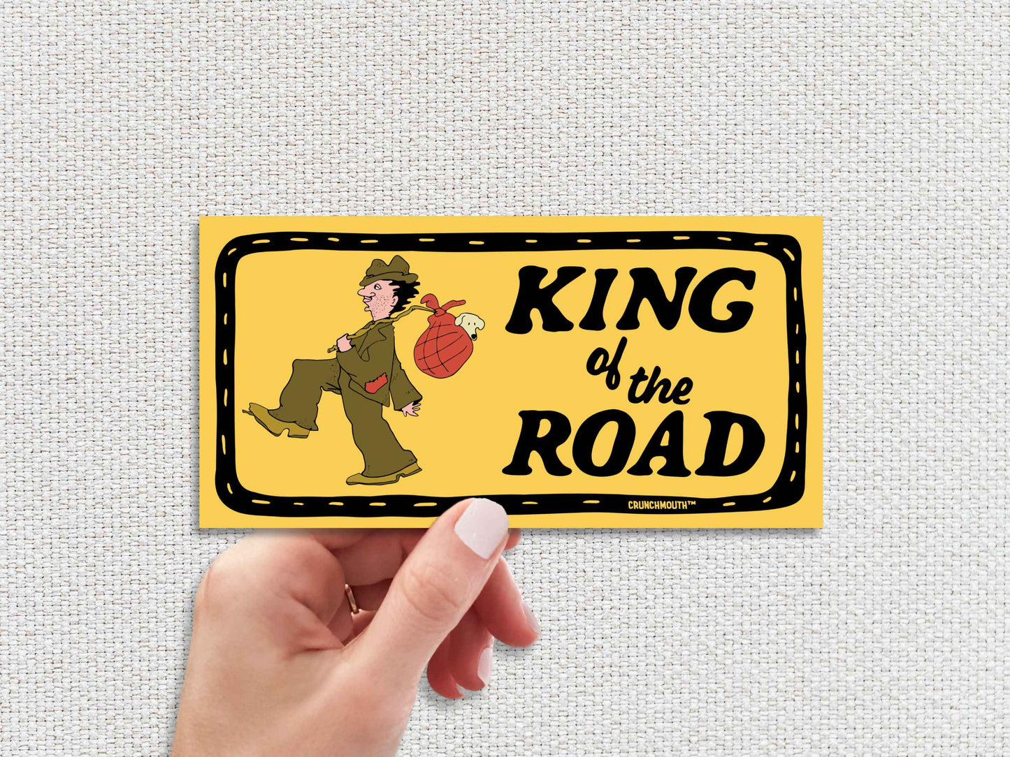 king of the road bumper sticker, hand display, white textured background