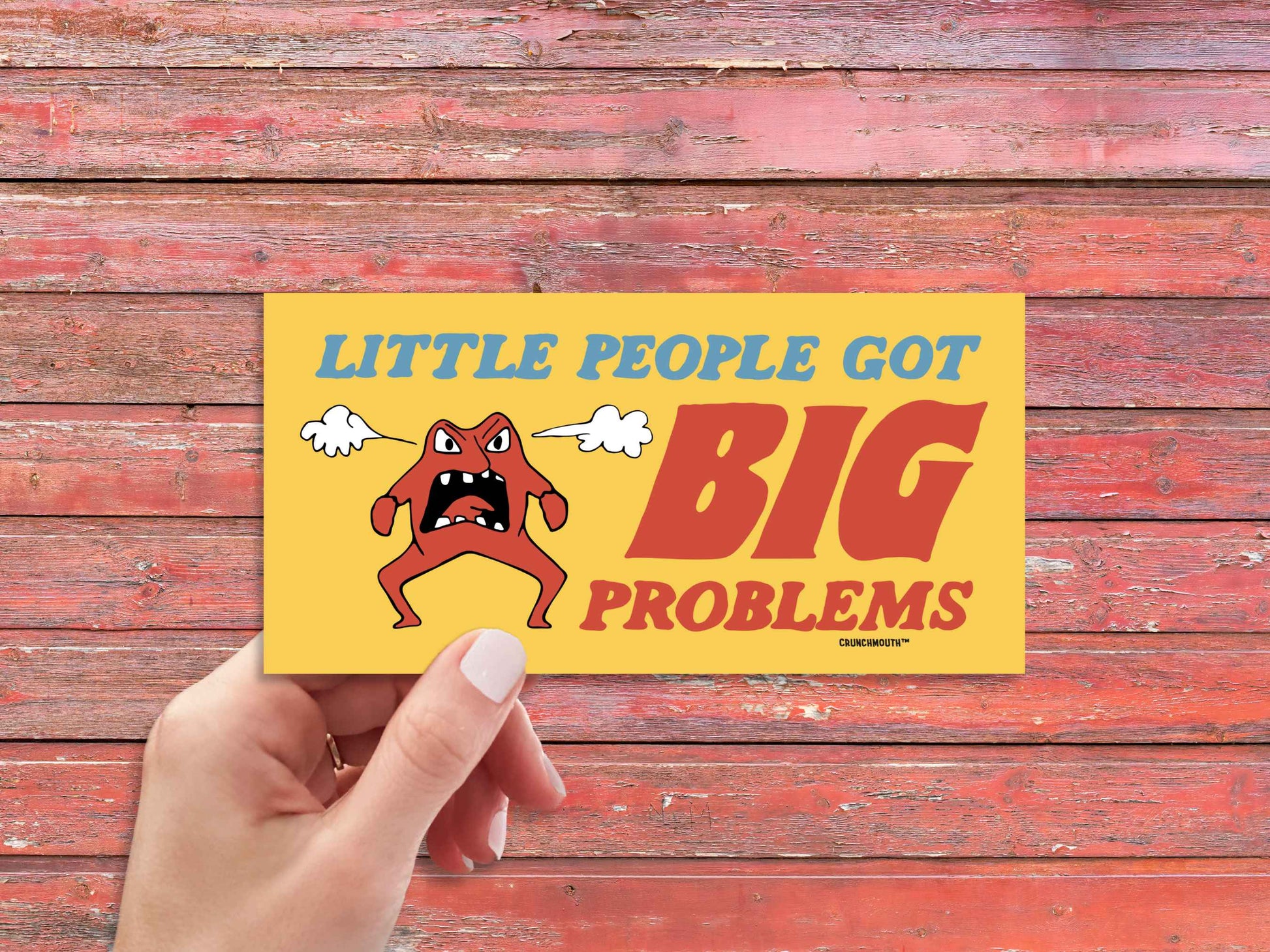 little people got big problems bumper sticker, funny bumper stickers, hand display, red wood panel background