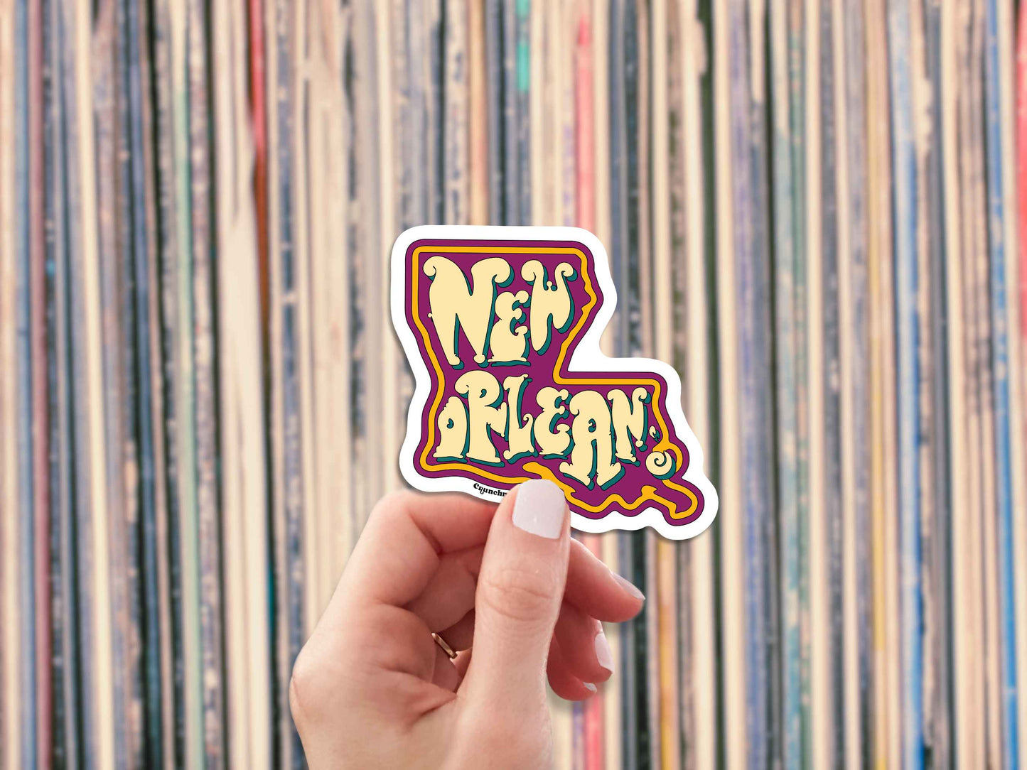 new orleans travel luggage sticker, hand display, vinyl record collection background