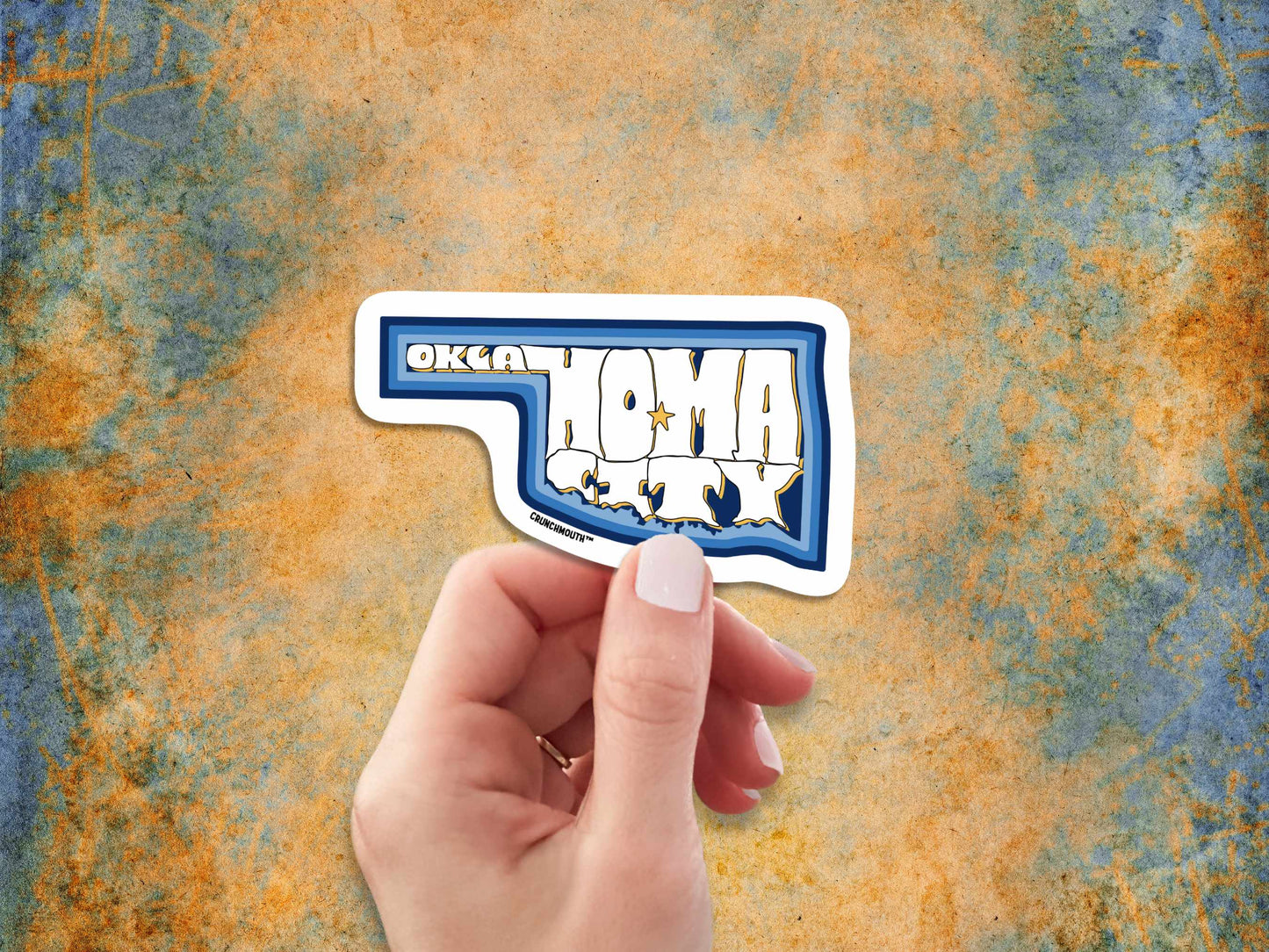 oklahoma city travel luggage sticker, hand display, rusty patina background