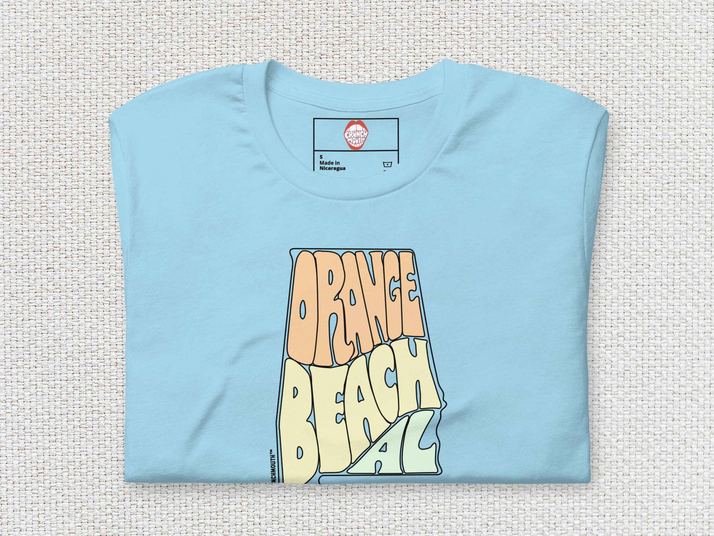 orange beach shirt, folded, front, white textured background