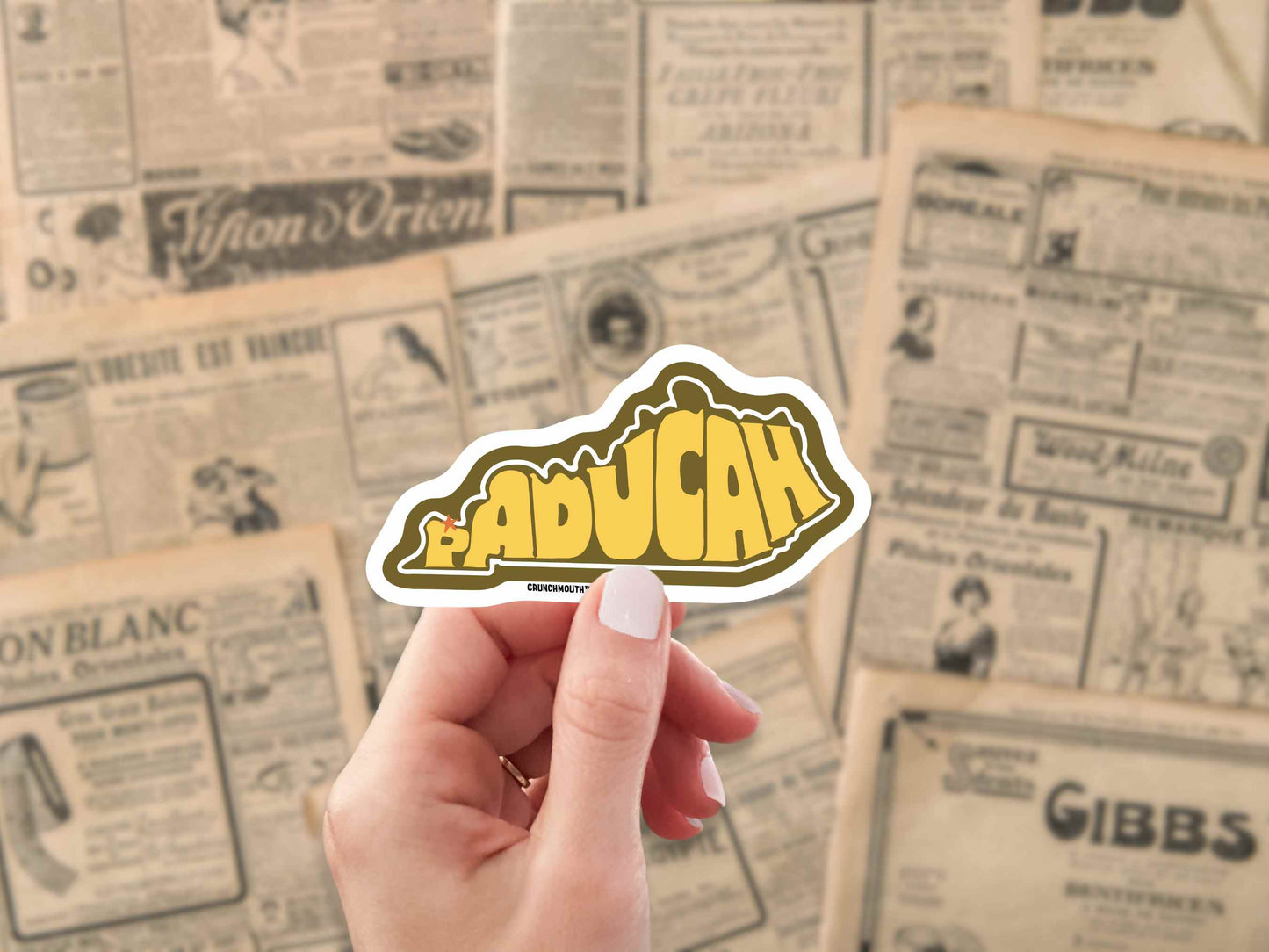 paducah kentucky travel luggage sticker, hand display, antique newspaper ads background