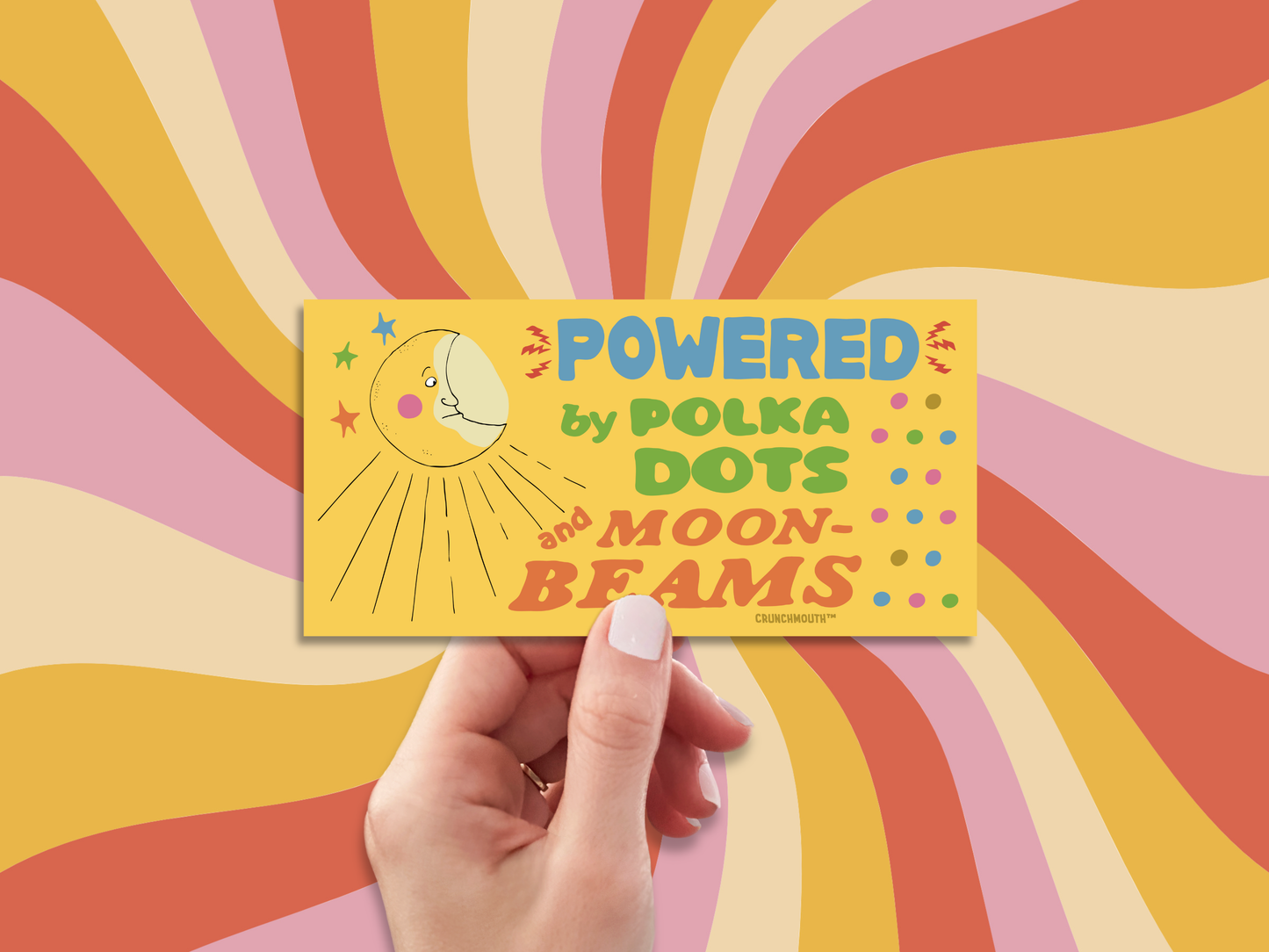 powered by polka dots and moonbeams bumper sticker, hand display, wavy sun rays design background