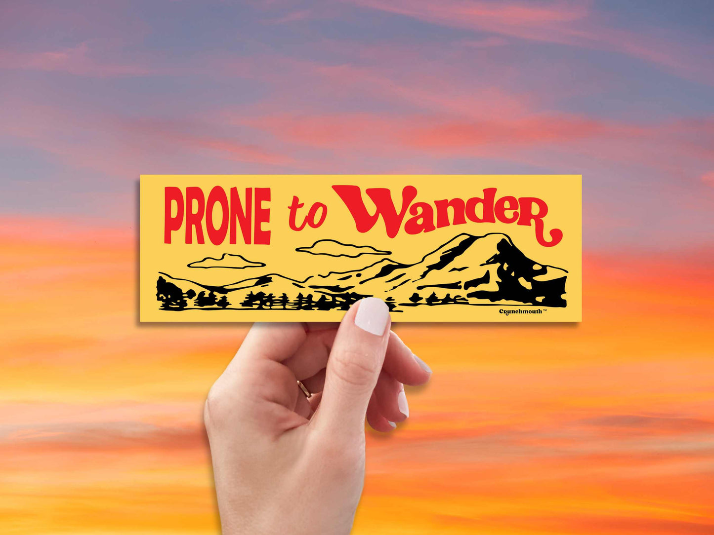 prone to wander bumper sticker, yellow, hand display, red sky background