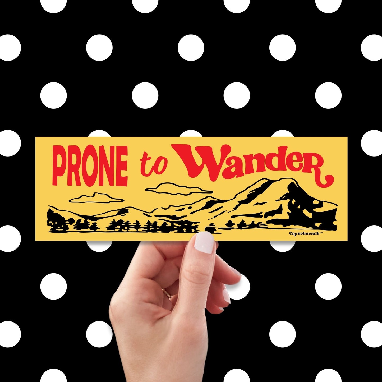 prone to wander bumper sticker, yellow color, hand display, polka dots pattern design background