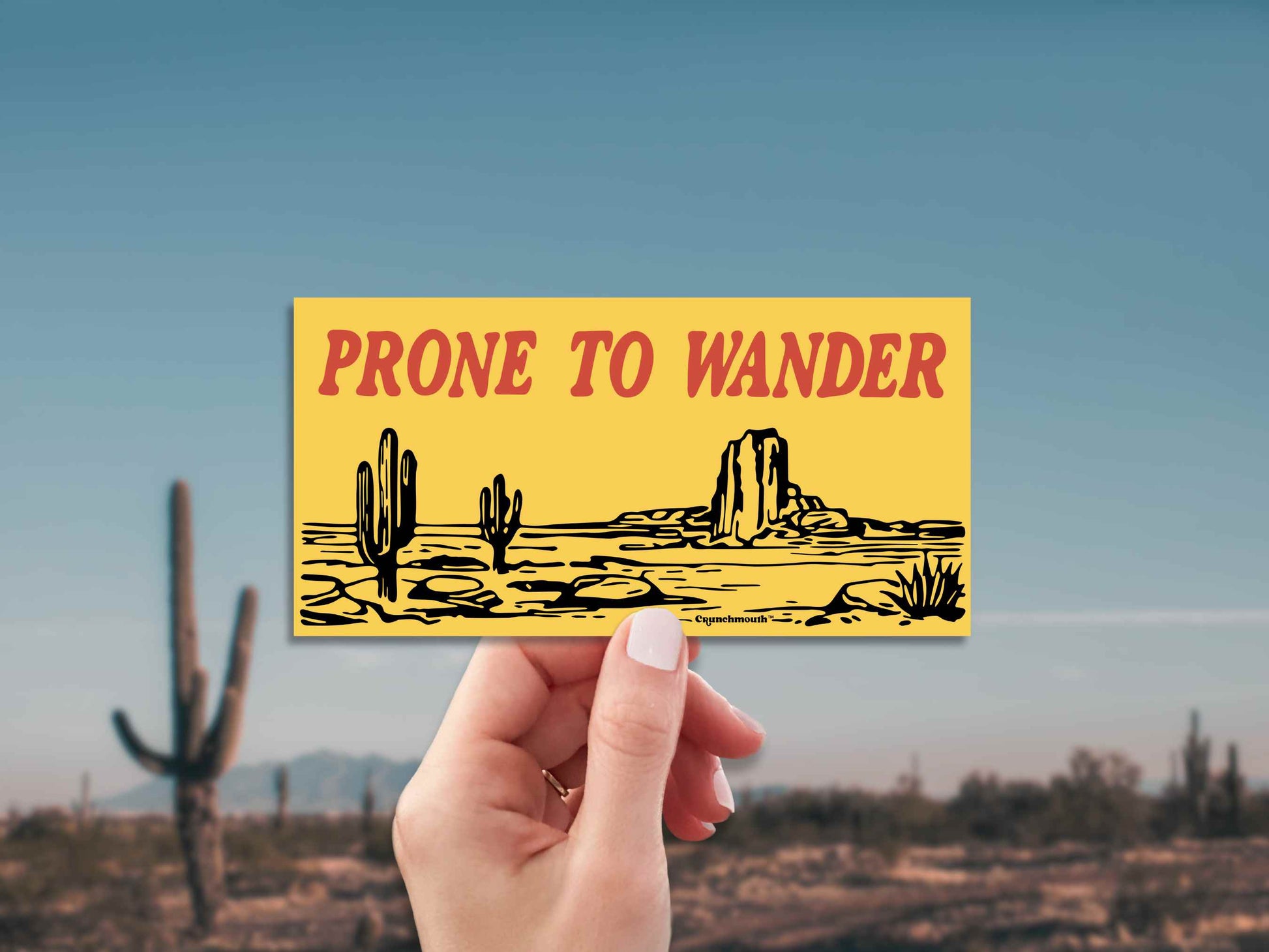 desert adventure bumper sticker, prone to wander, cacti desert landscape background