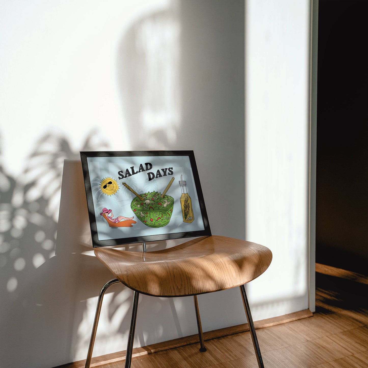salad days wall art, displayed in in context in home, on top of chair