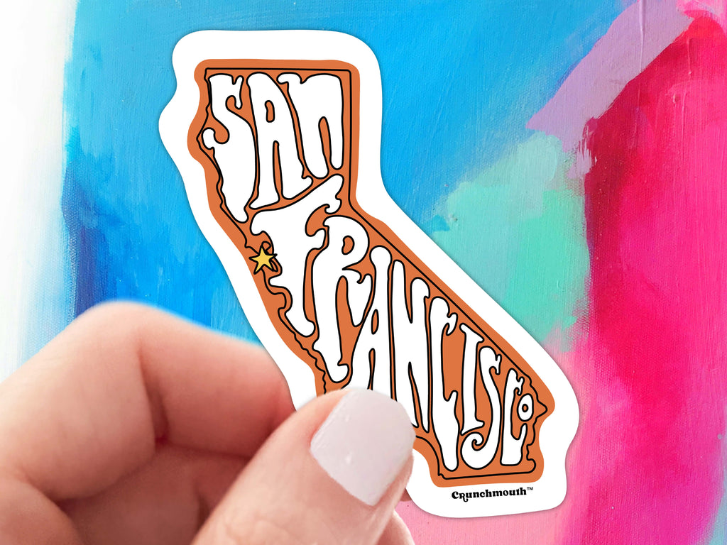 san francisco sticker, held in hand, colorful paint background