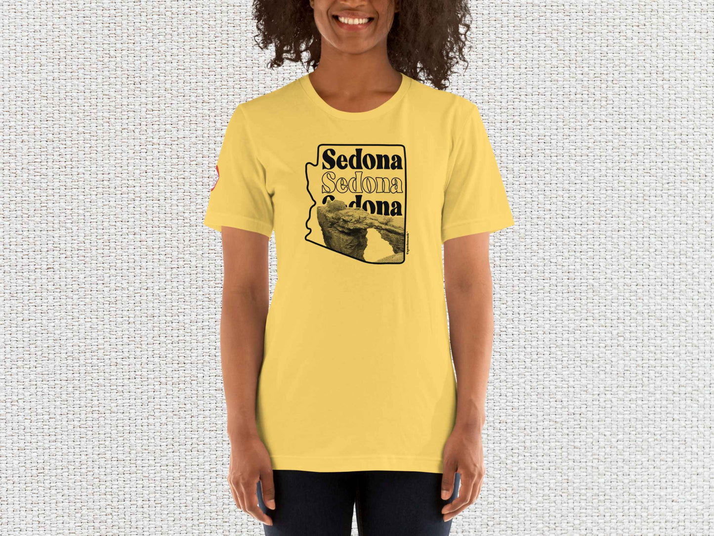 sedona shirt, souvenir t shirts, female model, front, white textured background