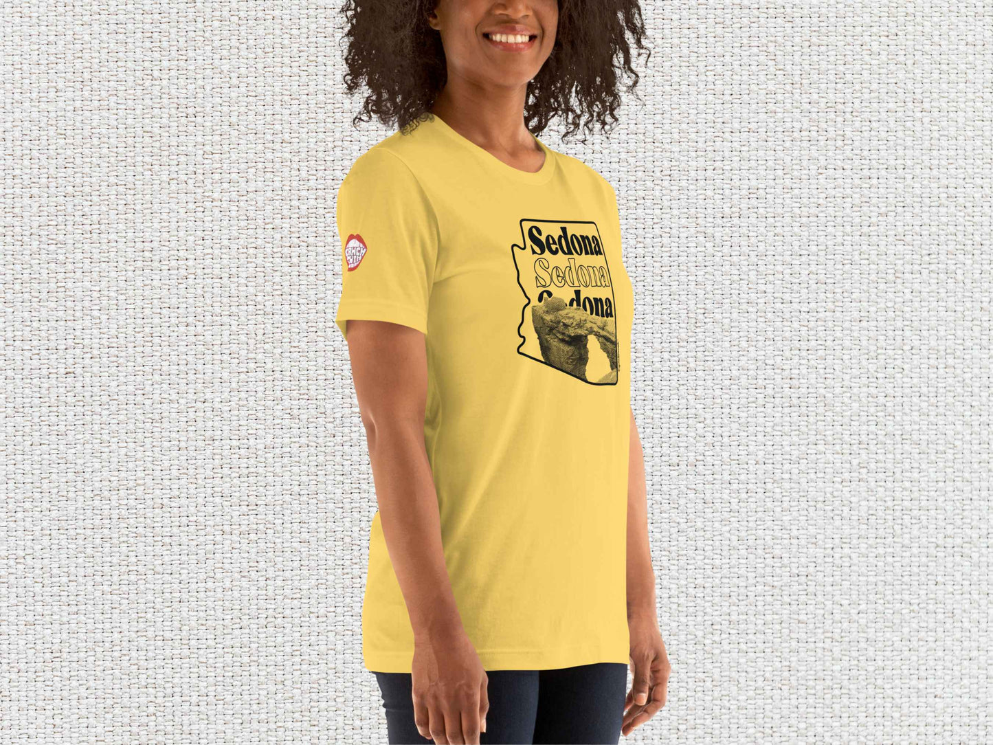 sedona shirt, souvenir t shirts, female model, front right, white textured background