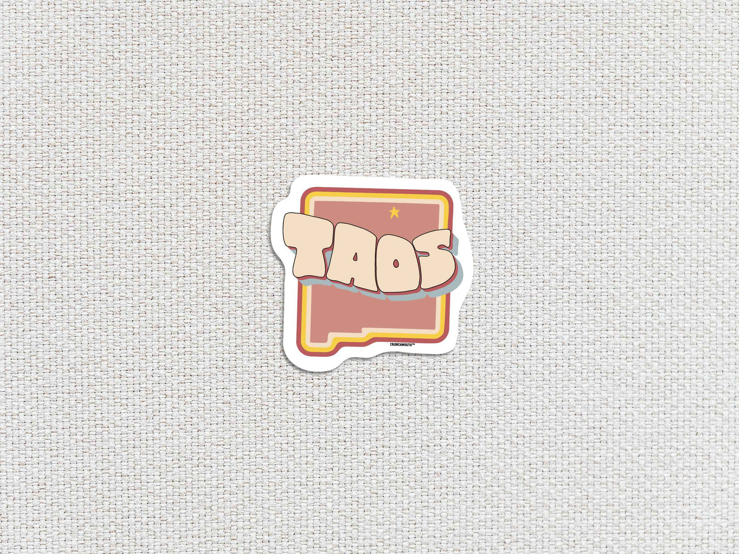 taos travel luggage sticker, white textured background