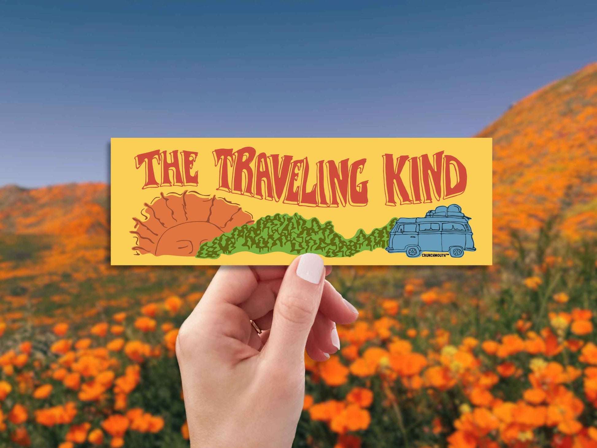the traveling kind bumper sticker, hand display, landscape background