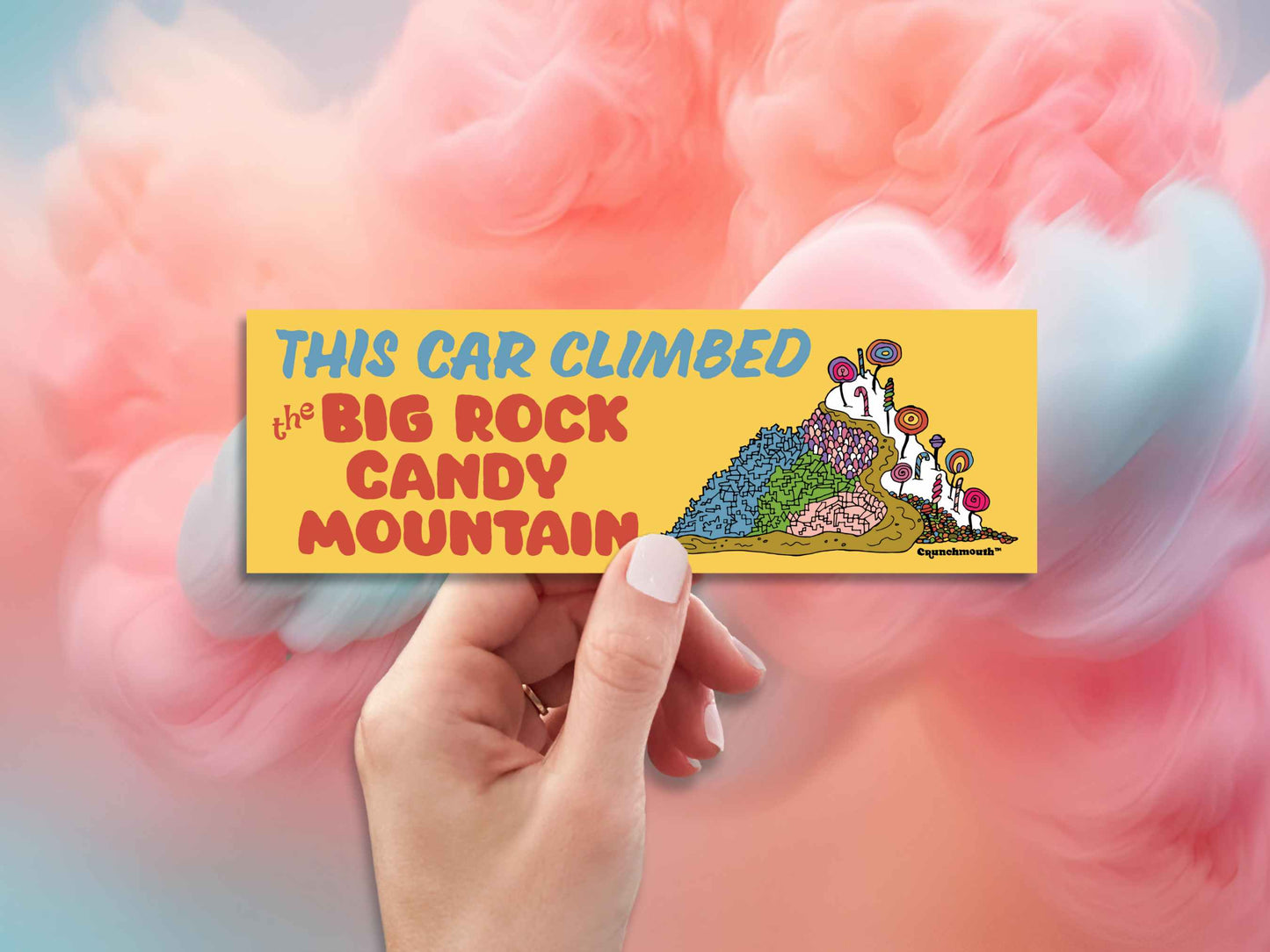 this car climbed the big rock candy mountain, hand display, cotton candy clouds background
