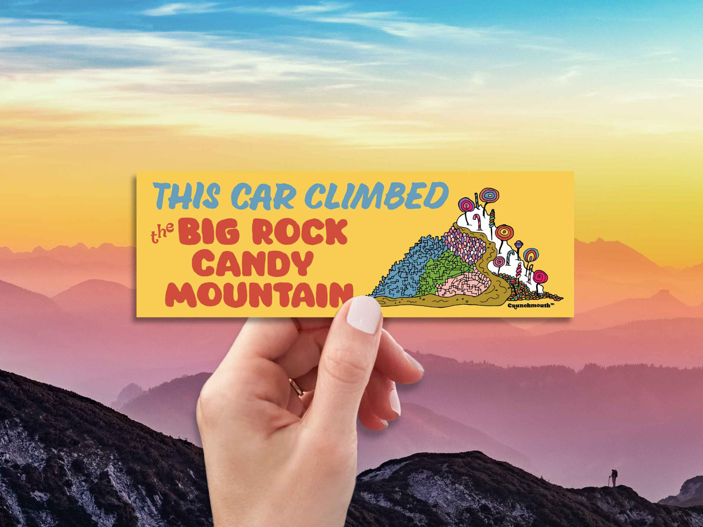 this car climbed the big rock candy mountain, funny bumper stickers, hand display, mountain skyline background