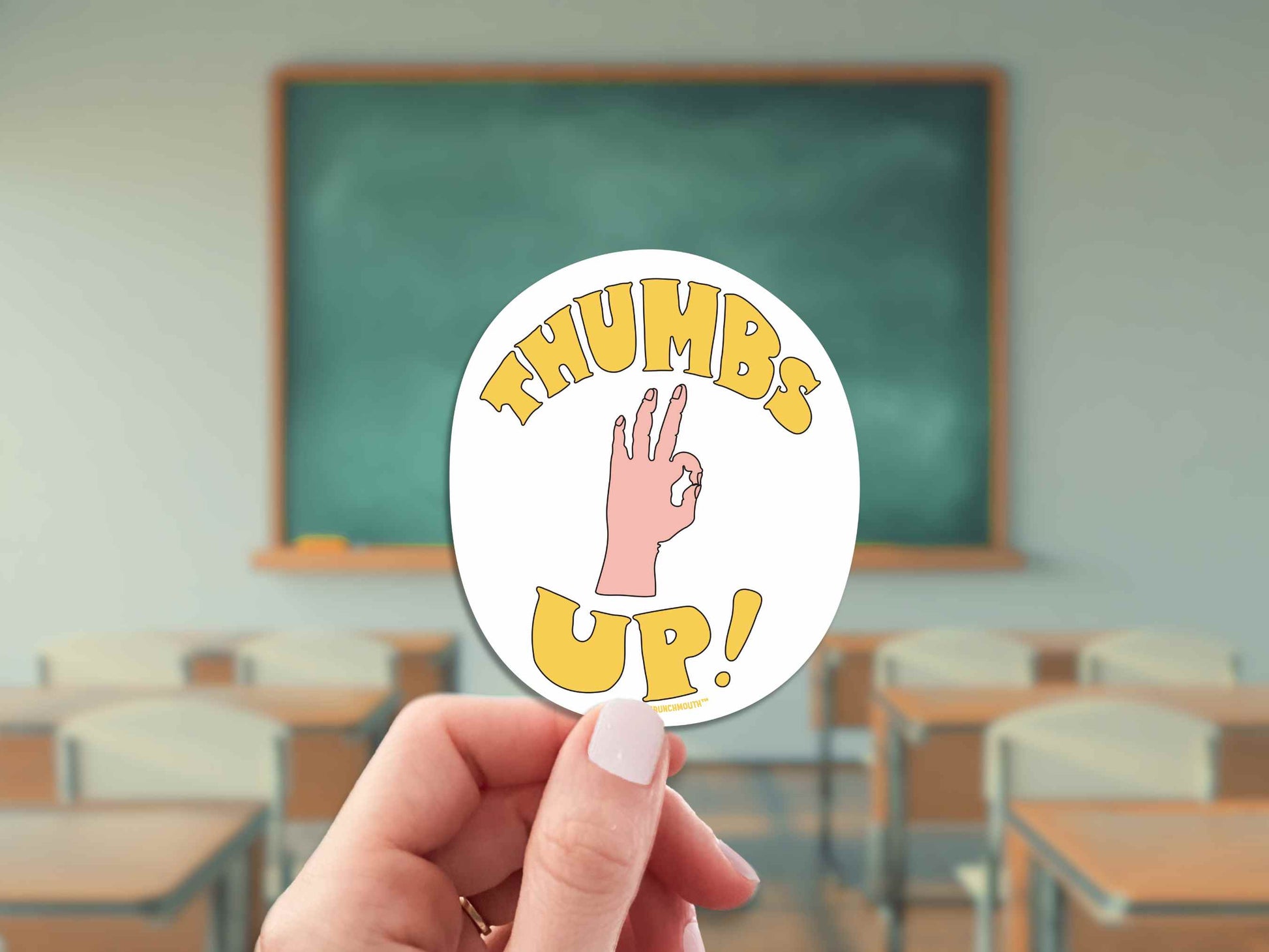 thumbs up sarcastic motivational sticker, hand display, classroom blackboard background