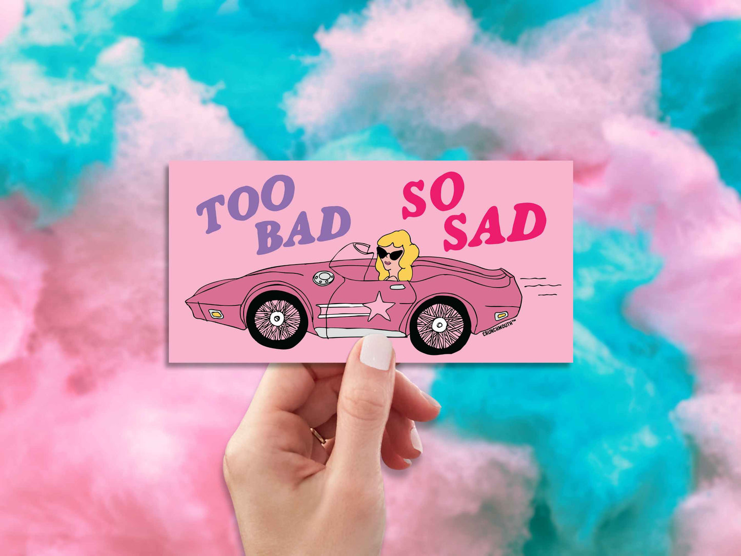 too bad so sad bumper sticker, hand display, cotton candy background