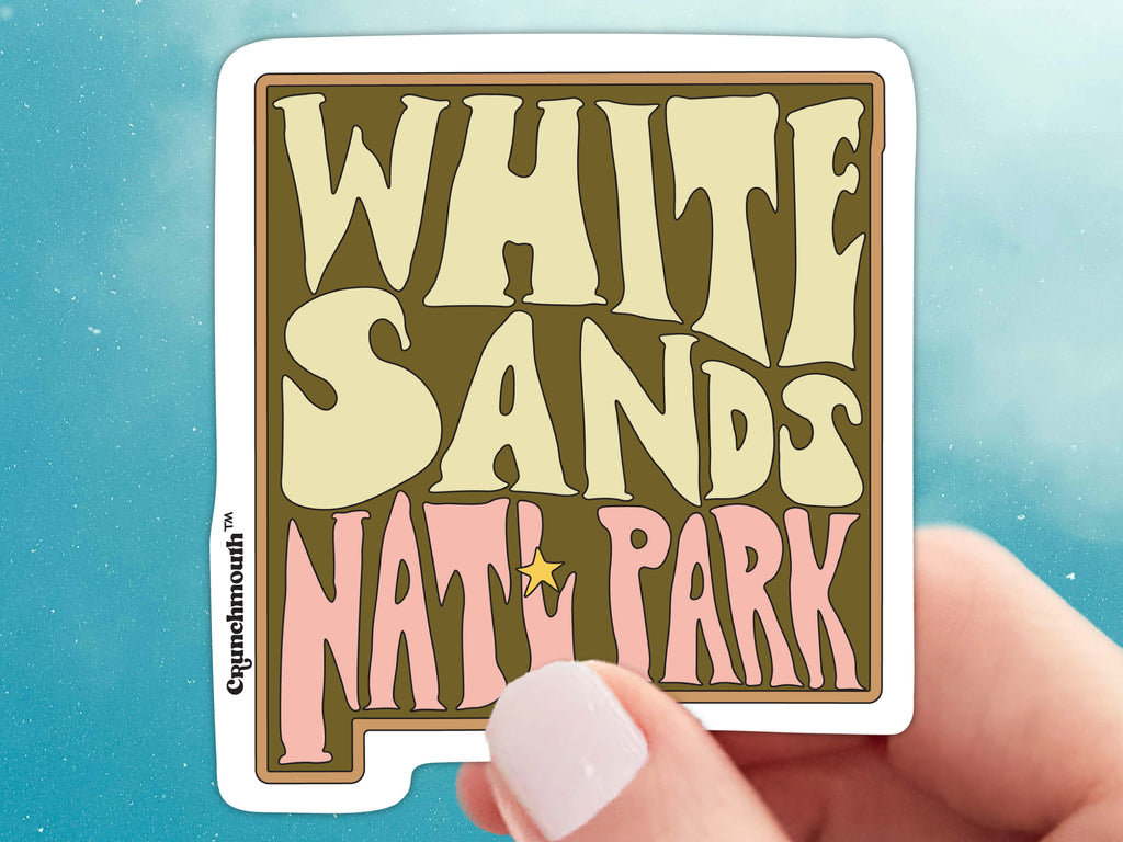 white sands national park sticker, held in hand, blue sky background