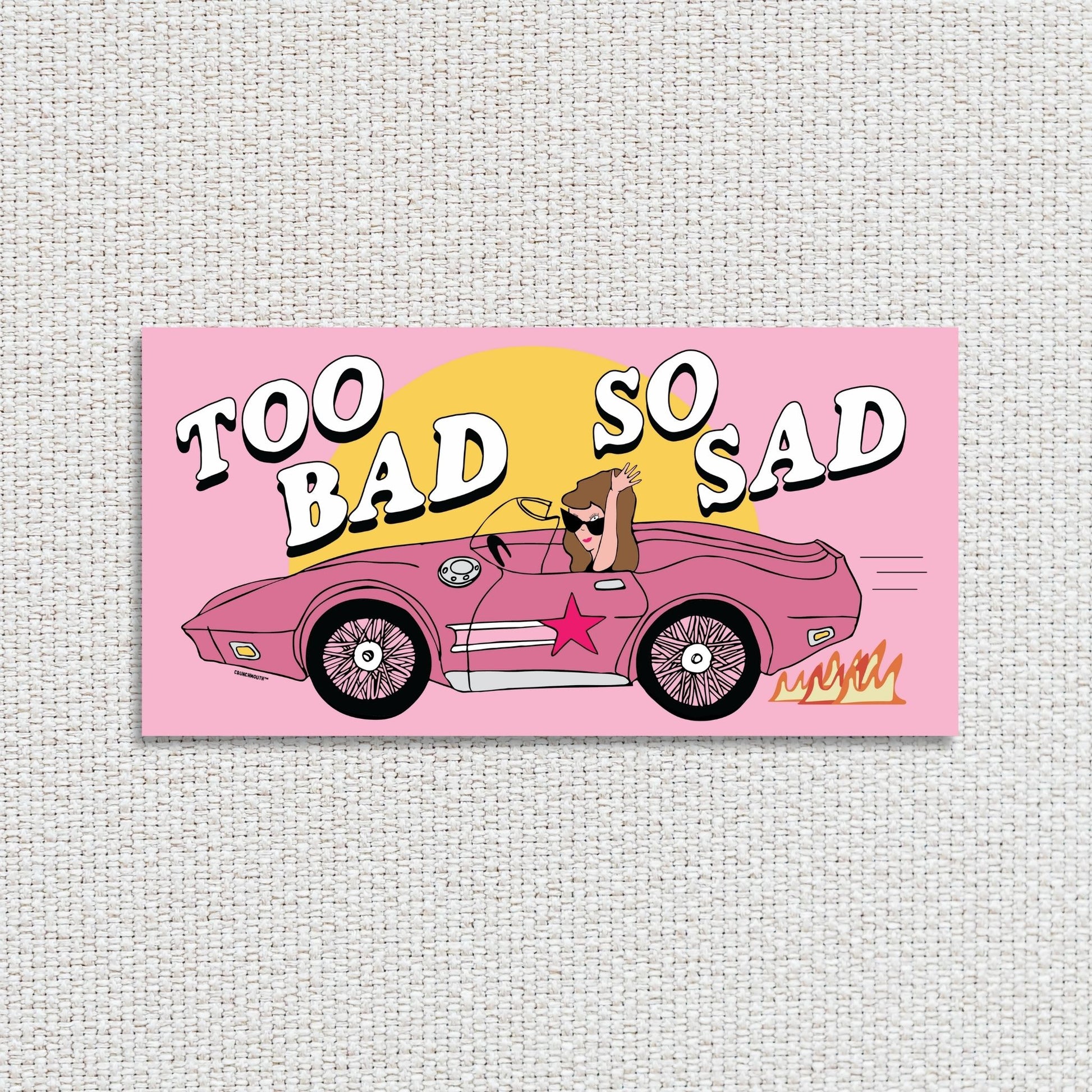 too bad so sad bumper sticker, textured fabric background