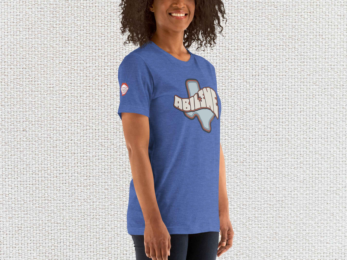 abilene texas souvenir t shirt, female model, front right, white textured background