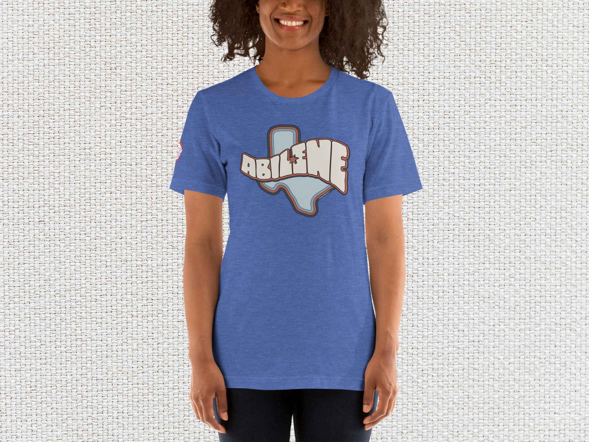 abilene texas souvenir t shirt, female model, front, white textured background