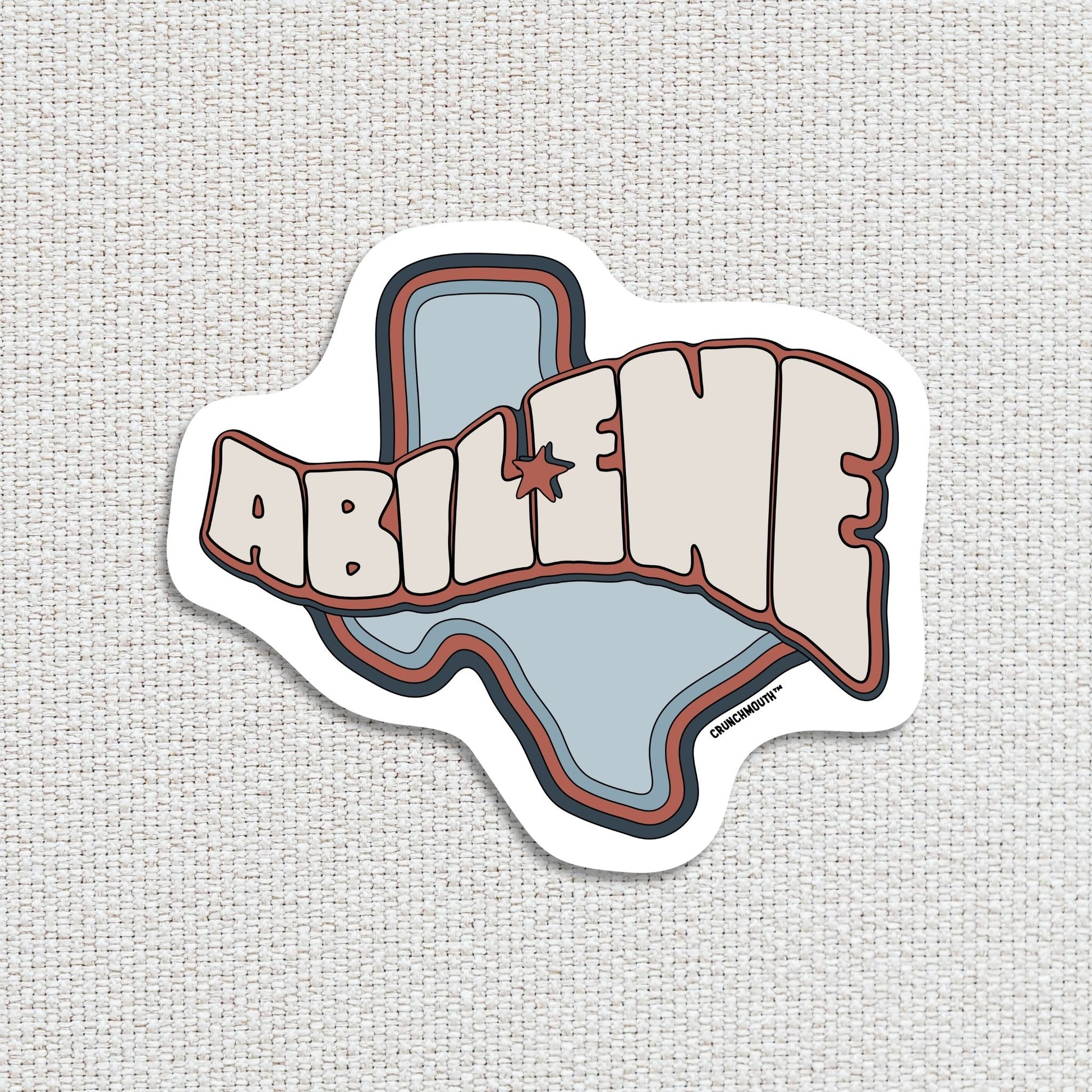 Abilene travel luggage sticker, textured fabric background
