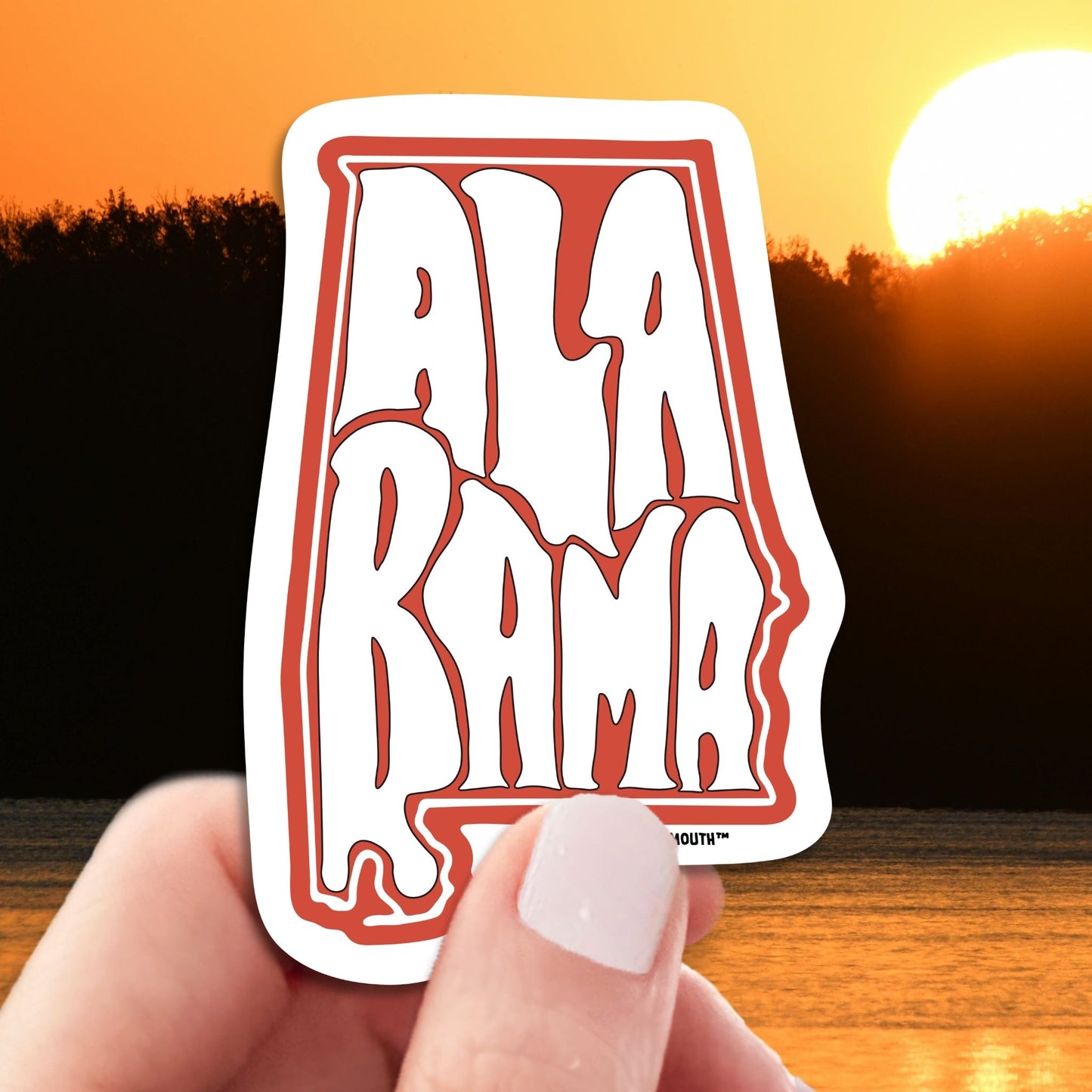 Alabama travel luggage sticker, hand display, Alabama sunset background
