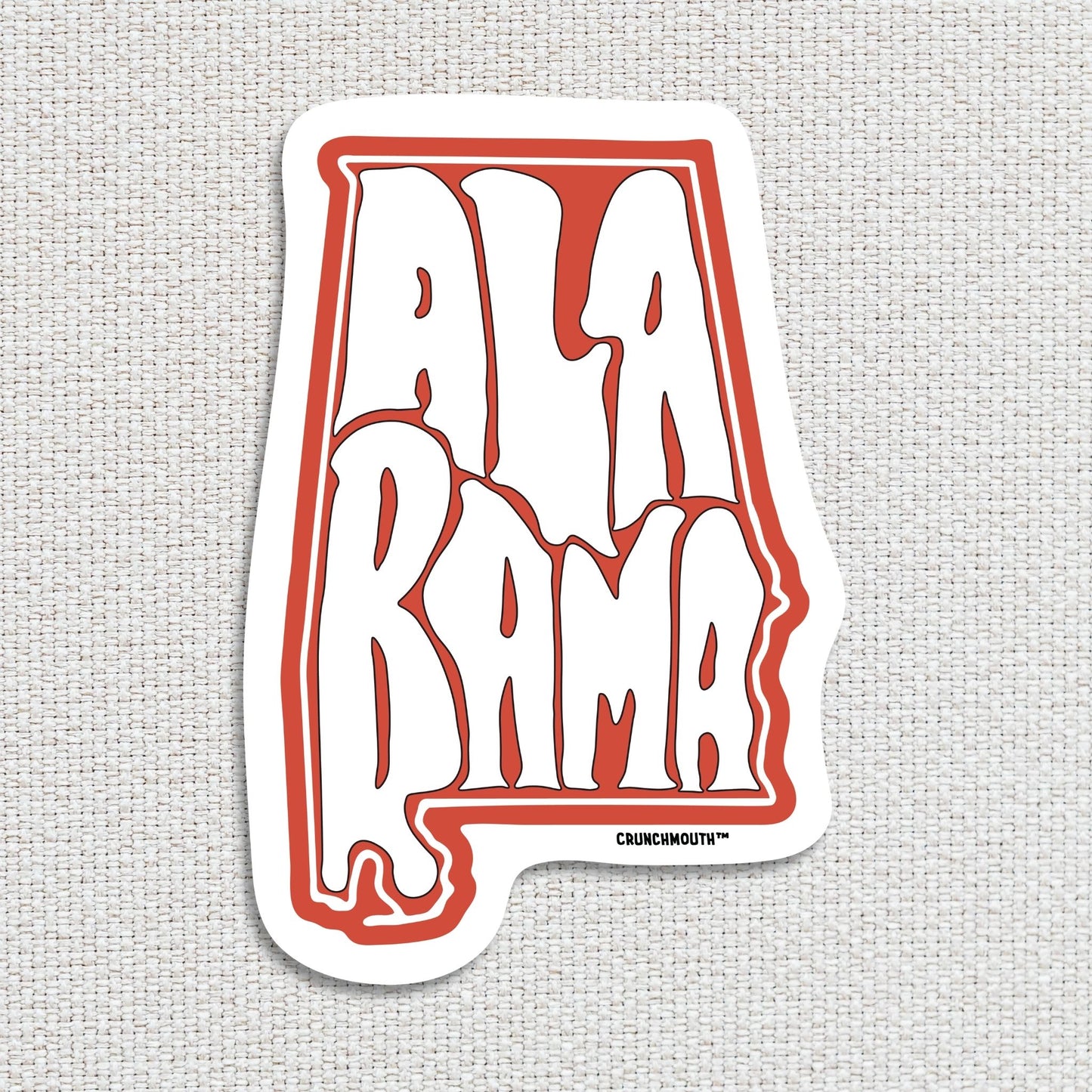 Alabama travel luggage sticker, textured fabric background
