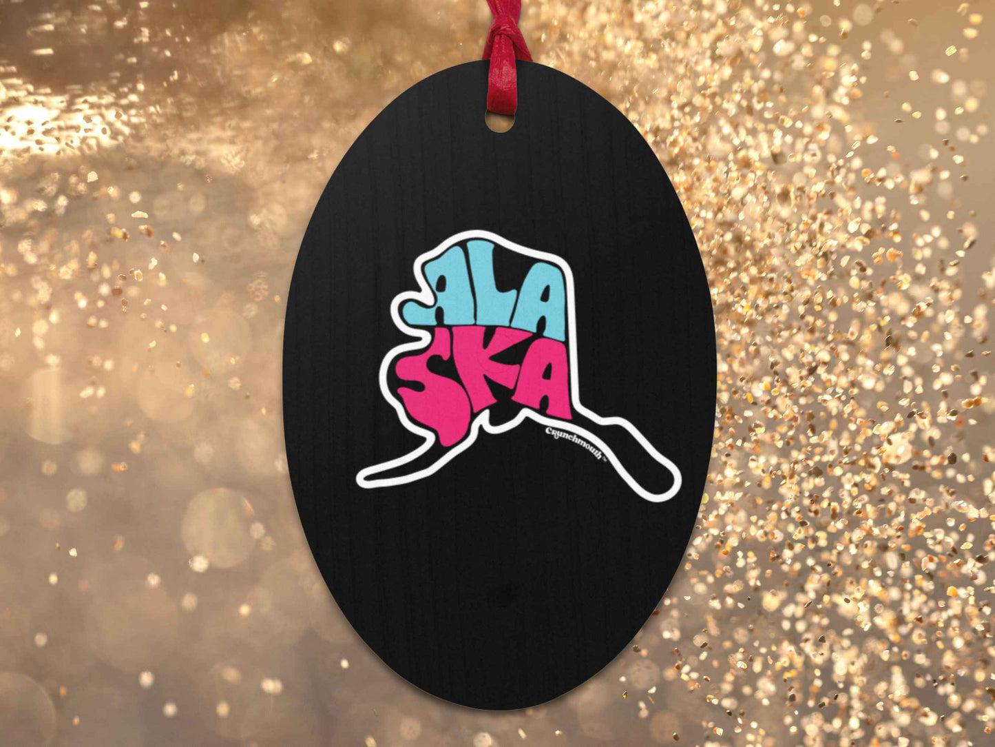 alaska Christmas ornament, back, gold glitter background