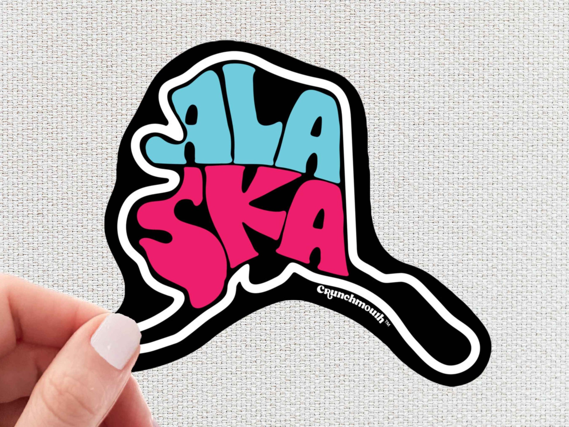 alaska sticker, travel luggage stickers, hand display, white textured background