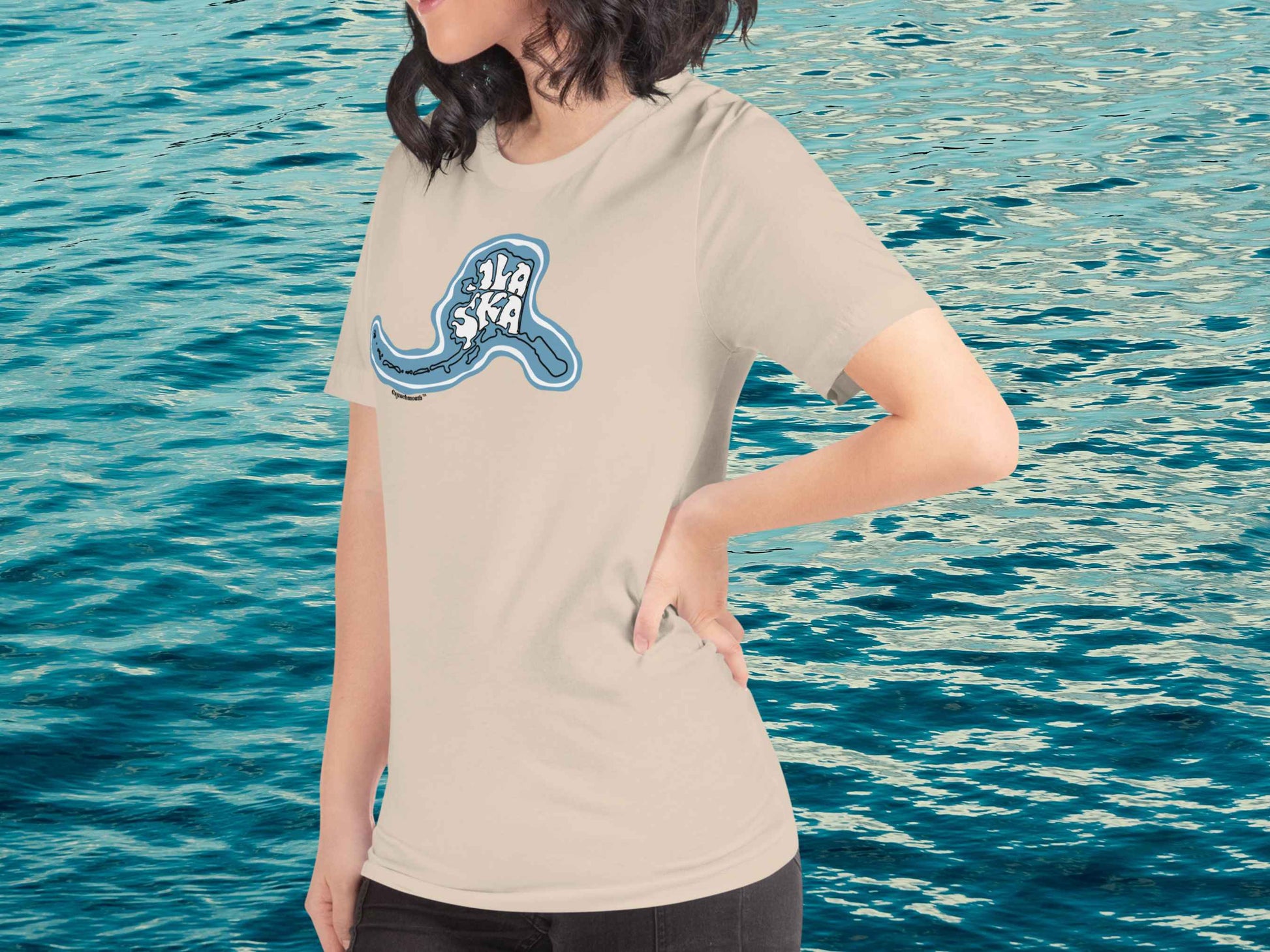 alaska t shirt, souvenir shirts, left front, female model, blue ocean water background