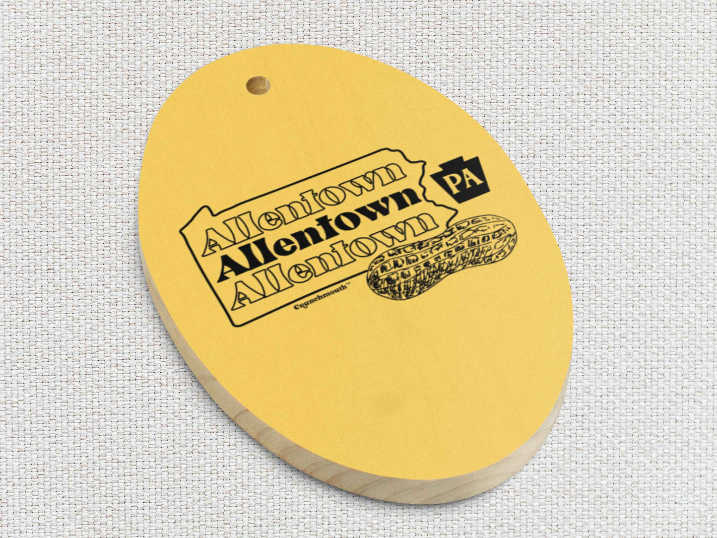 allentown wooden Christmas ornament, front lower side, white textured background