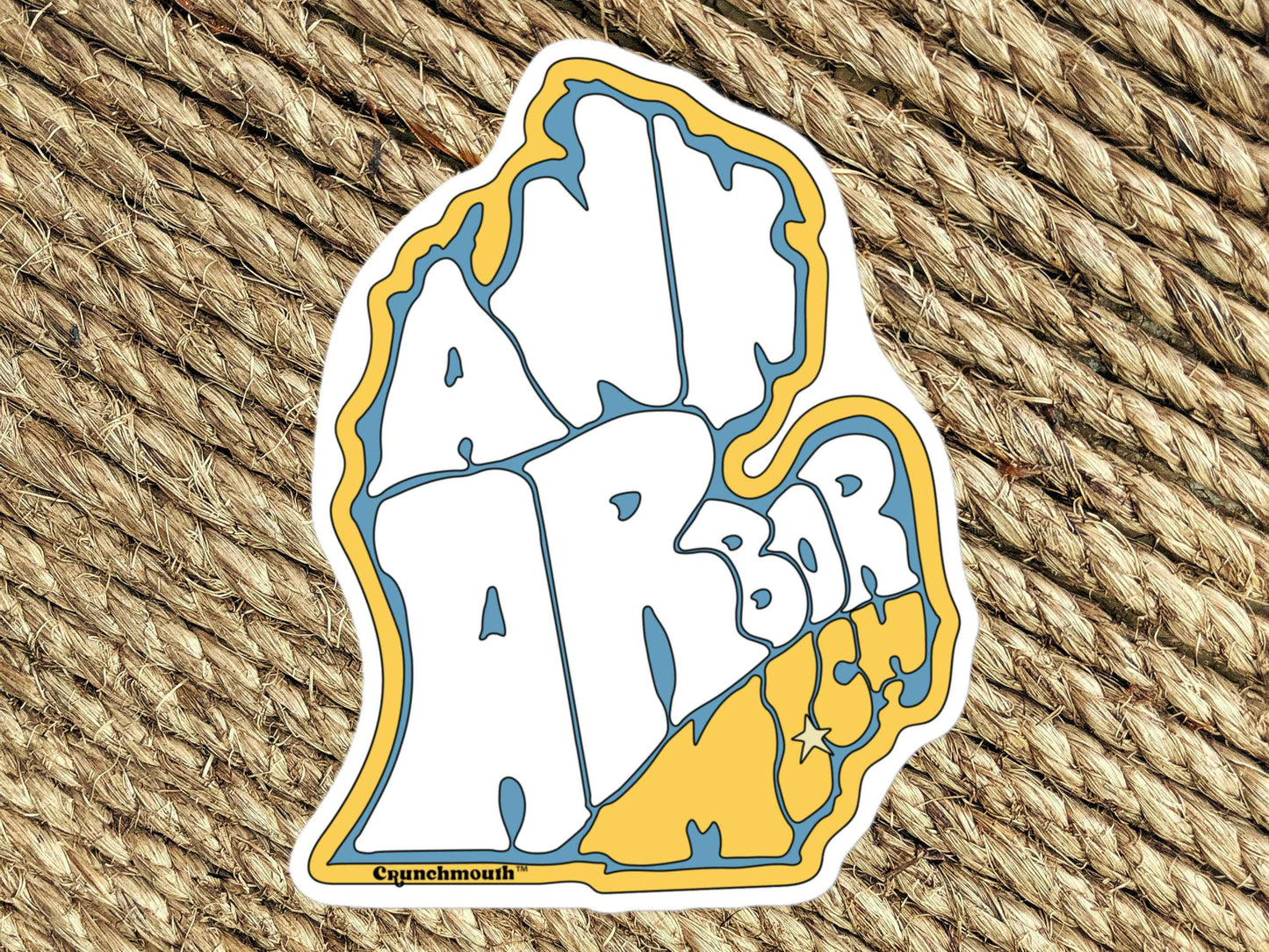 ann arbor sticker, souvenir stickers, brown woven rug background