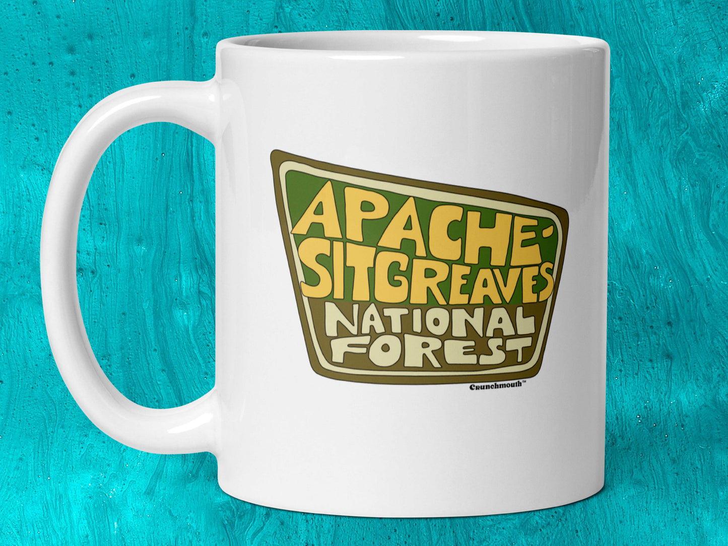 apache-sitgreaves national forest 11oz coffee mug, handle on left, aqua blue background