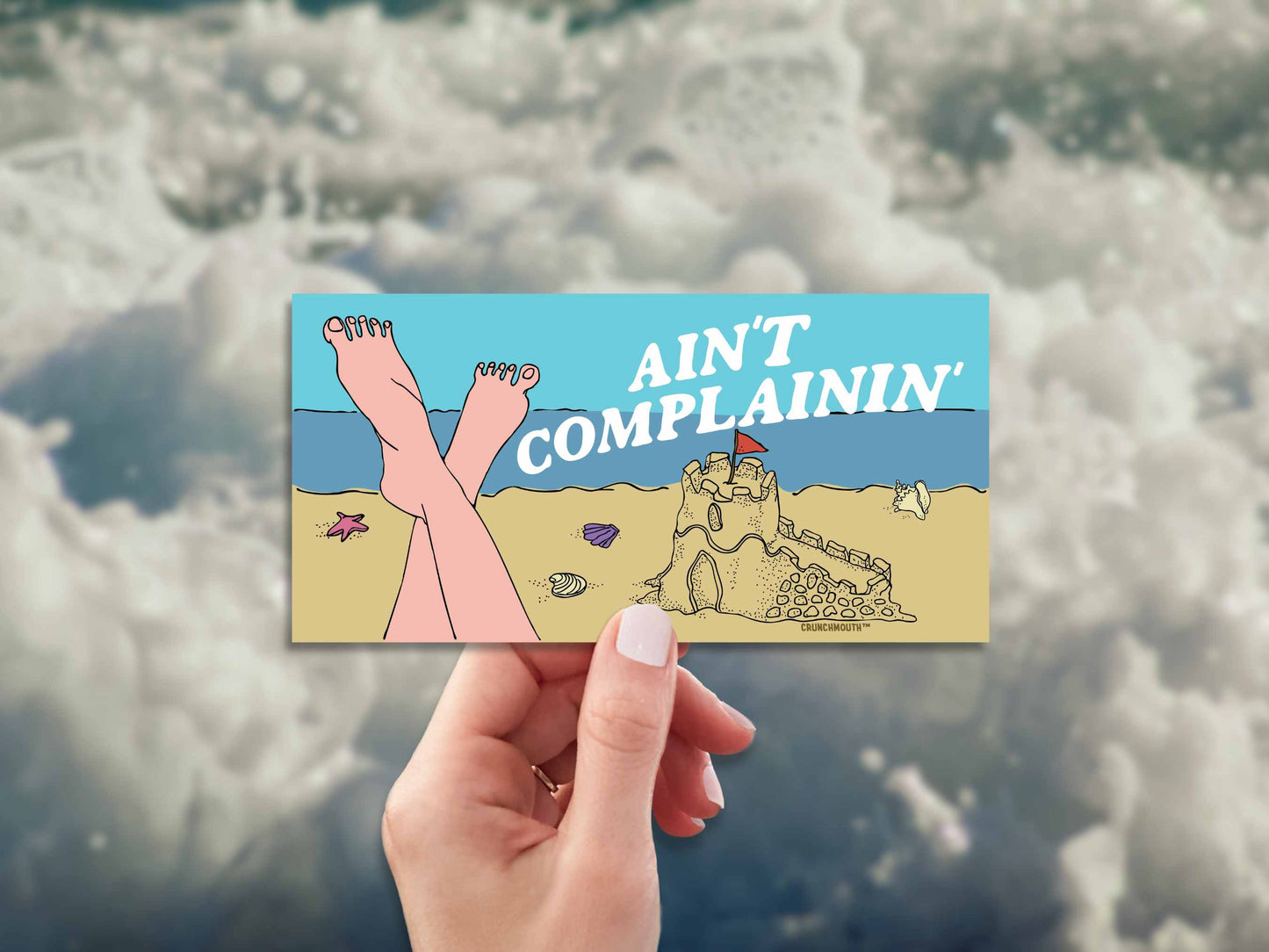 beach vibes bumper sticker, ain't complainin', hand display, white water background