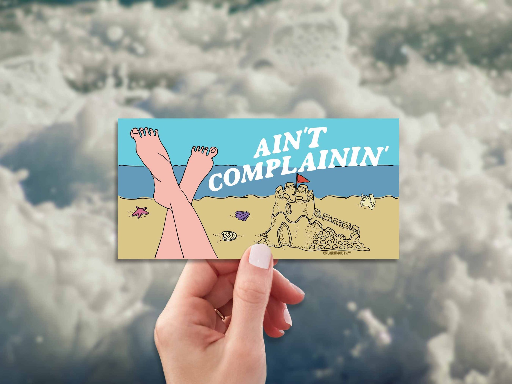 beach vibes bumper sticker, ain't complainin', hand display, white water background